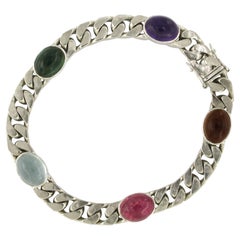Bracelet with garnet, tourmaline, aquamarine, and amethyst 18k gold 41.9 grams