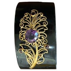 Bracelet with gold application, amethyst, and quartz on horn material