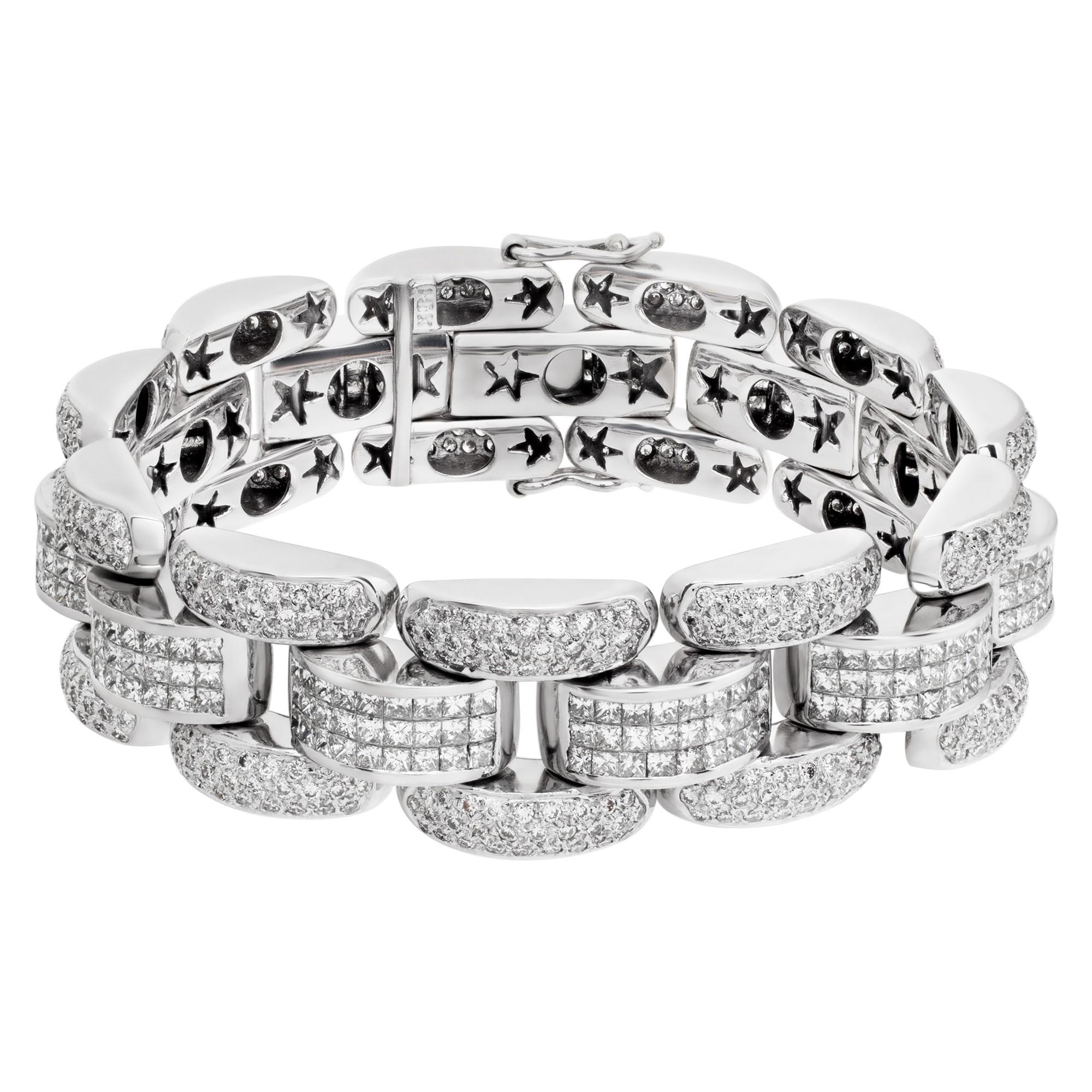 ESTIMATED RETAIL: $48,000.00
YOUR PRICE: $30,688.00

Link bracelet with invisible set princess and full round brilliant cut diamonds in 18k white gold totaling approximately 16 carats in F-G color, VS1 clarity diamonds. 
Width: 17mm 
Length: 7.5