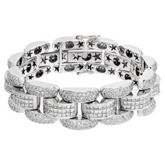 Bracelet en or blanc 18 carats avec diamants princesse et diamants taille ronde sertis de manière invisible