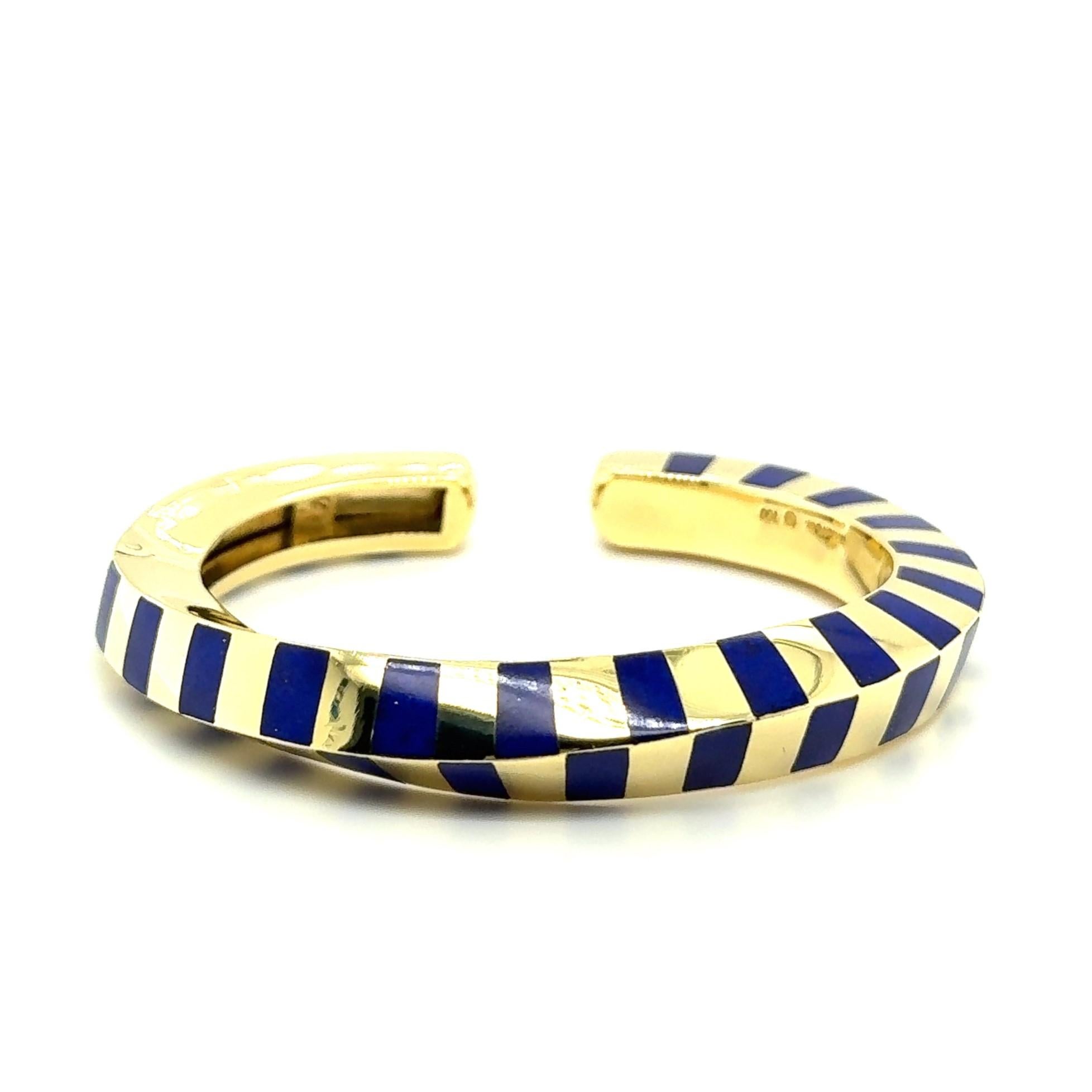 This exquisite cuff bracelet, crafted in 18 Karat gold and adorned with 41 vivid lapis lazuli inlays, is a masterpiece of elegance and artistry. Designed by Angela Cummings for Tiffany & Co., it reflects her renowned approach to blending bold