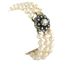 Bracelet with pearls and diamonds 14k yellow gold and silver