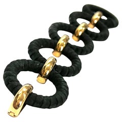 Bracciale con maglie rotonde in pelle nera combinate con maglie in oro rosa 18k