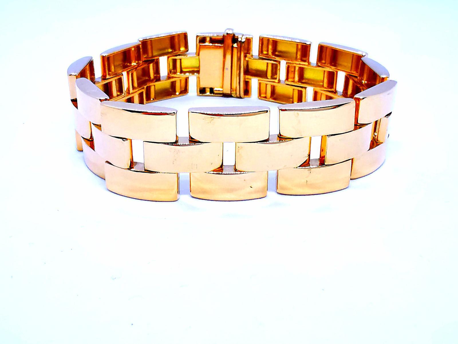 Yellow gold bracelet 750 mils (18 carats). mesh articulated with safety clasp. length: 20 cm. width: 1.77 cm. thickness: 0.36 cm. total weight: 75.79 g. punch head eagle . excellent condition
