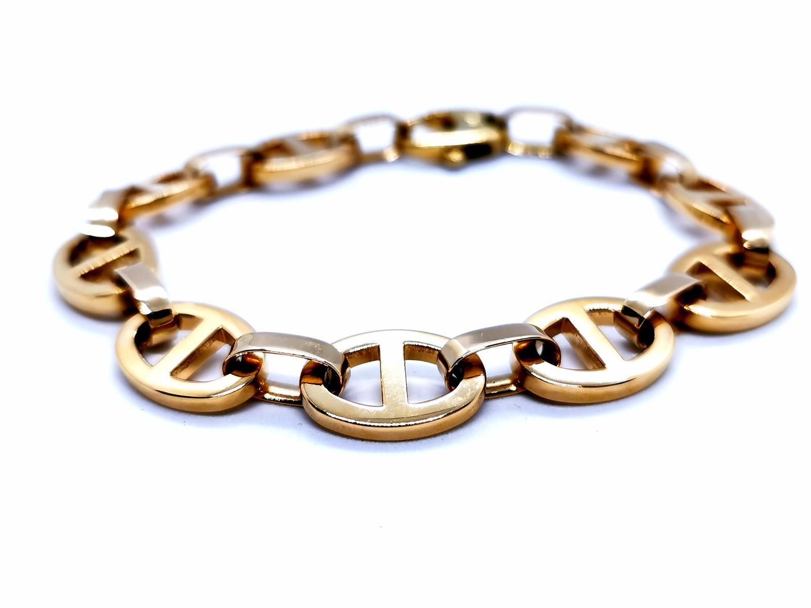 Yellow gold bracelet 750 mils (18 carats). marine mesh. solid. length: 21 cm. width: 1.13 cm. dimensions of the links: 1.65 cm x 1.13 cm. total weight: 42.06 g. punch eagle's head. excellent condition
