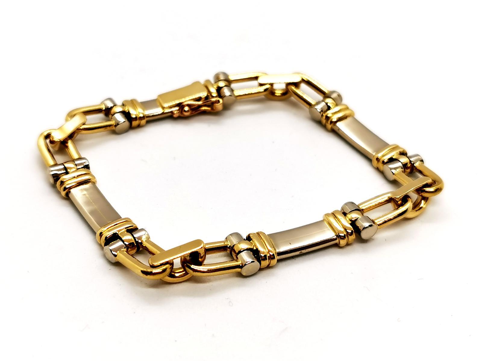Chain bracelet caliper. yellow gold and white gold 750 mils (18 carats). length: 19cm. width: 0.79 cm. thickness: 0.60 cm. with eight safety clasp. total weight: 25.64 g. punched owl. excellent condition.
