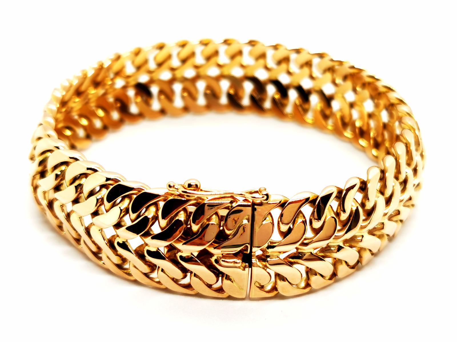 Bracelet cuff in Yellow Gold 750 thousandths (18 carats). double gourmet mesh. length: 9 cm. width: 1.5 cm. depth: 0.6 cm. clasp with a safety eight. total weight: 70.21 g. hallmark. excellent condition.

