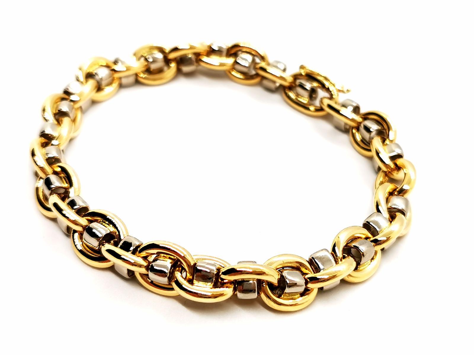 Bracelet in yellow and white gold 750 thousandths (18 carats). soft mesh. clasp with eight safety. length: 22 cm. width: 0.96 cm. total weight: 41.42 g. eagle head hallmark. excellent condition
