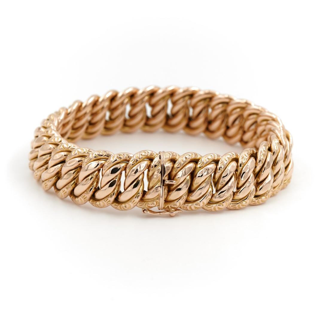 Bracelet in yellow gold 750 thousandths (18 carats). American mesh. closure in eight safety. length: 19.8cm. width: 1.55. Thickness: 0.44cm. weight: 41.50g. owl hallmark. excellent condition.

