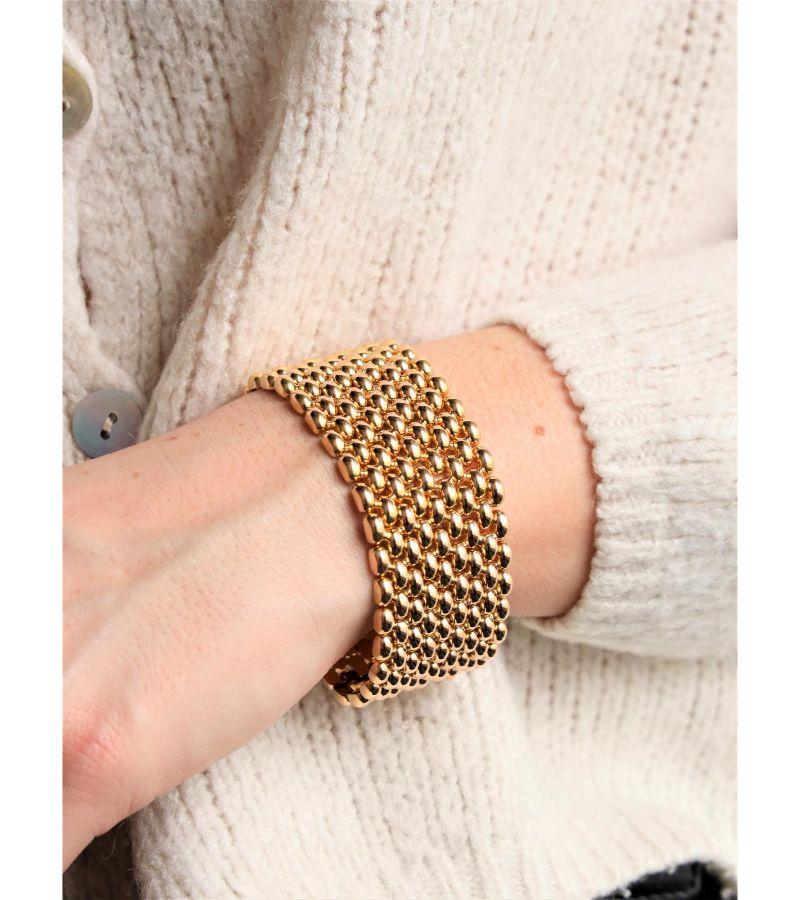 Bracelet cuff yellow gold 750 thousandths (18 carats). mesh thick grain of rice. length: 17.5 cm. width: 3 cm. total weight: 79.16 g. clasp with double eight safety. rhinoceros hallmark. excellent condition

