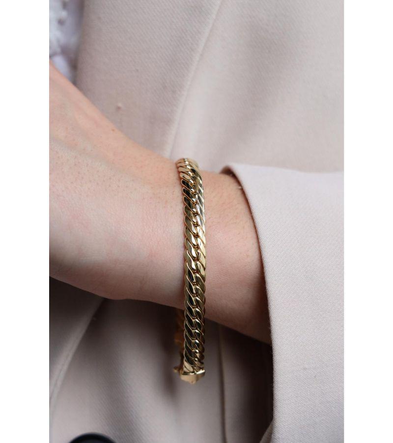 Bracelet in yellow gold 750 thousandths (18 carats). English mesh. length: 19.5 cm. width: 0.67 cm. thickness: 0.25 cm. total weight: 15.40 g. eagle head hallmark. excellent condition


