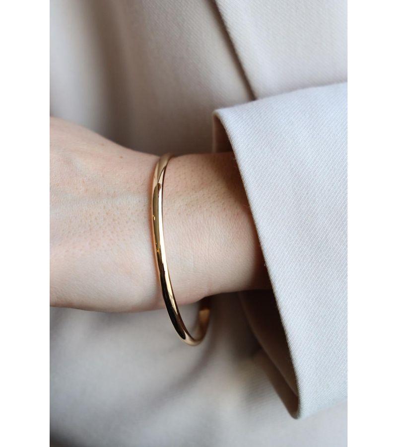Armband in Gelbgold 750 Tausendstel (18 Karat). Innendurchmesser: 6,5 cm. Breite des Rings: 0,38 cm. Gesamtgewicht: 21,92 g. Punsch Adlerkopf. ausgezeichneten Zustand
