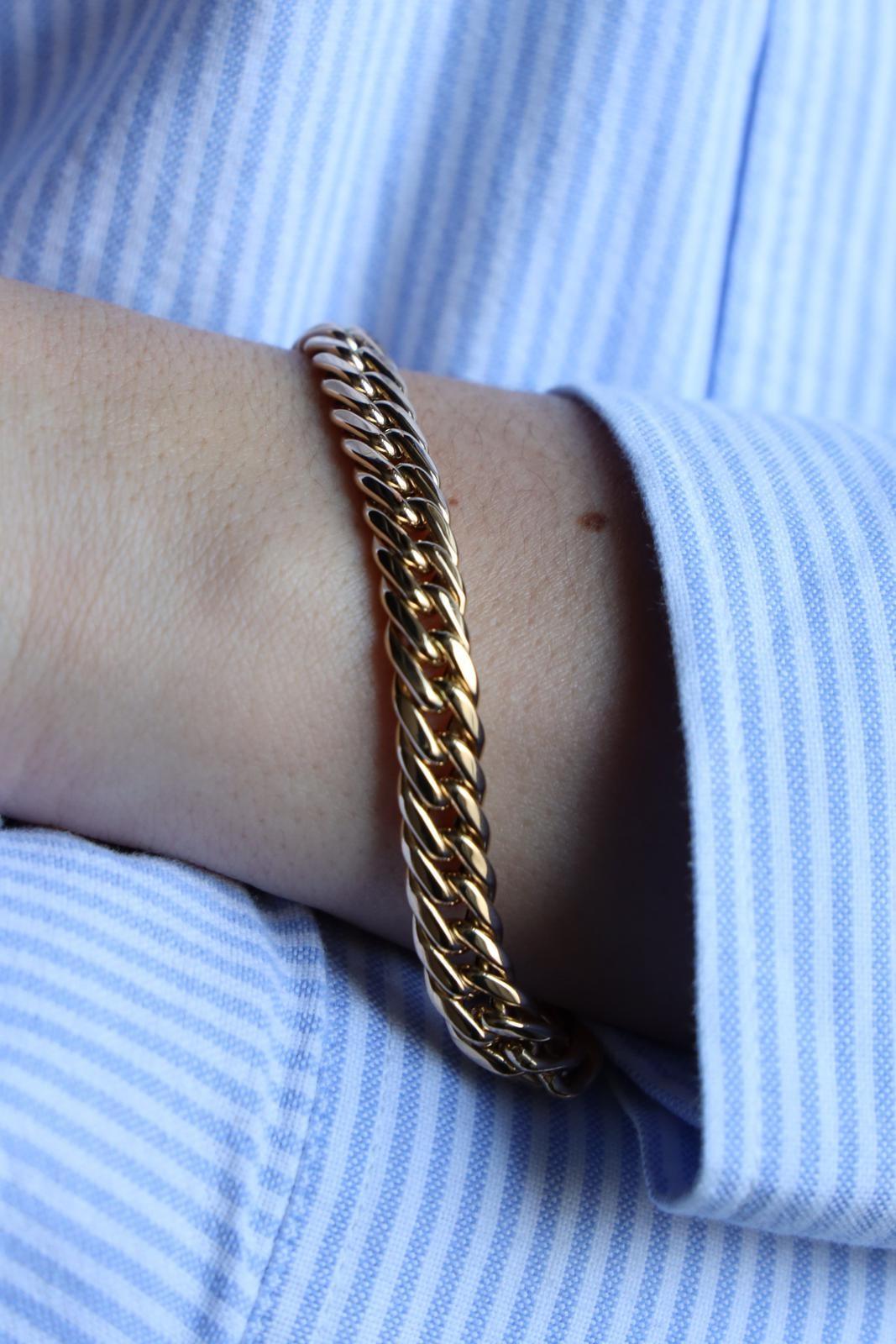 Bracelet in yellow gold 750 thousandths (18 carats). American mesh. length: 19.50 cm. width: 0.70 cm. clasp with eight security. total weight: 19.27 g. eagle head punch. excellent condition