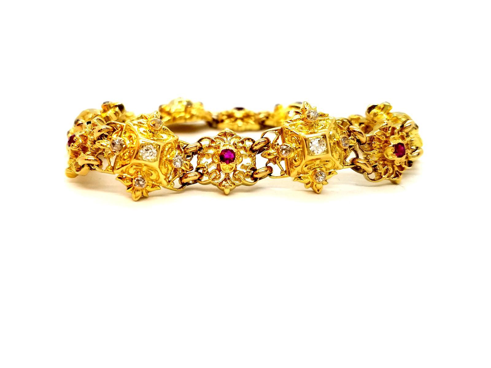 Bracelet Yellow Gold 750 thousandths (18 carats). set with 30 old cut diamonds totaling about 0.78 ct 6 round rubies for about 0.24 ct in total safety chain. length: 19.5 cm. width: 1.52 cm. thickness: 0.58 cm. total weight: 39.31 g. punched.