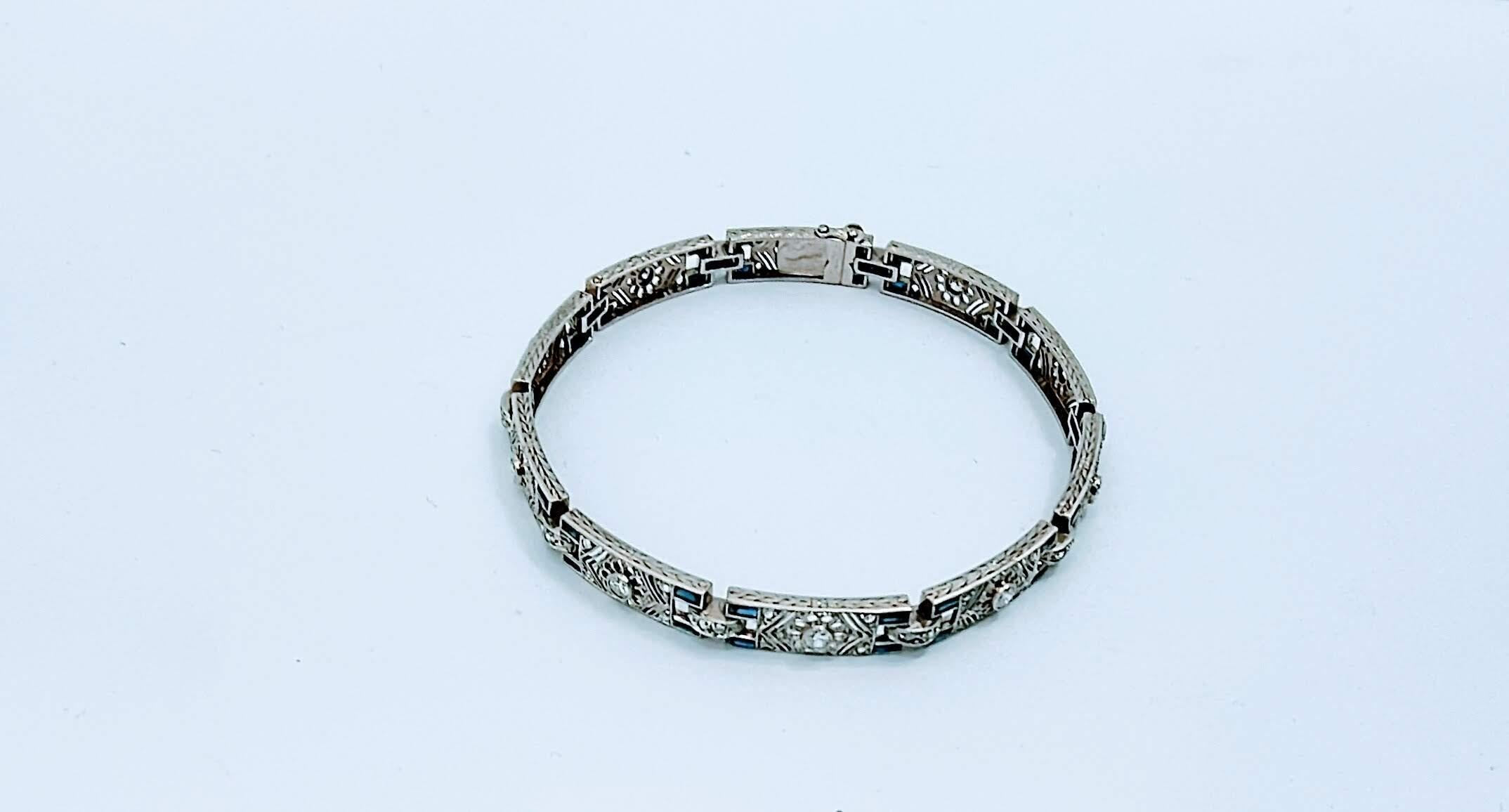 Beautiful Art deco 1930s bracelet handmade in white gold 18 Karats weight 14.32 grams, with 10 links of rectangular format slightly curved and delicate engraving of guard on the sides. With 10 Brilliant Cut Diamonds of 2.60 millimeters in diameter