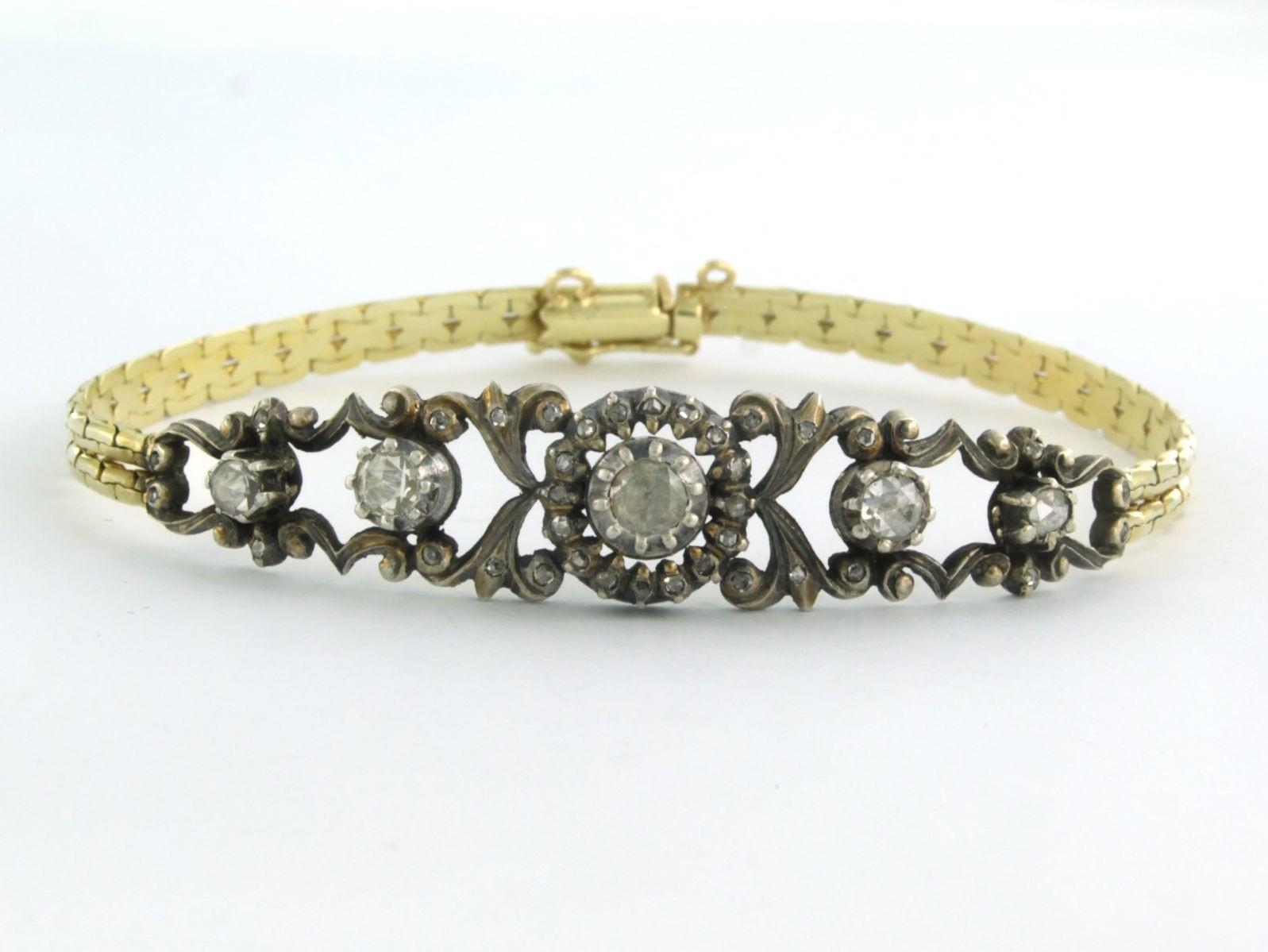 14k yellow gold with silver bracelet set with rose cut diamond 0.40 ct G/H SI - 18.5 cm

detailed description:

the length of the bracelet is 18.5 cm long and the strap is 4.4 mm wide

the center piece is approximately 5.5 cm long and 1.2 cm