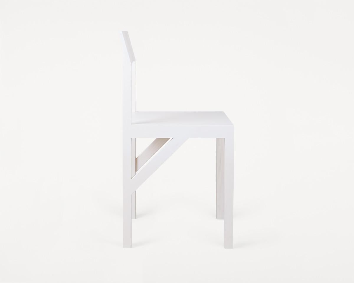 The bracket chair, designed in collaboration with Copenhagen-based design studio Frederik Gustav, is a four-legged piece fabricated in solid oiled pine with a flat seat and a slightly angled back-rest highlighted by a structural component, the