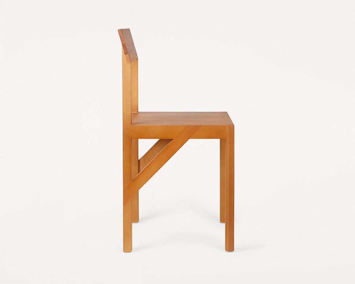 The Bracket chair, designed in collaboration with Copenhagen-based design studio Frederik Gustav, is a four-legged piece fabricated in solid oiled pine with a flat seat and a slightly angled back-rest highlighted by a structural component, the