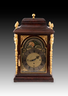 Bracket clock with astronomical dial and mahogany wood case. Amsterdam, 18th c.