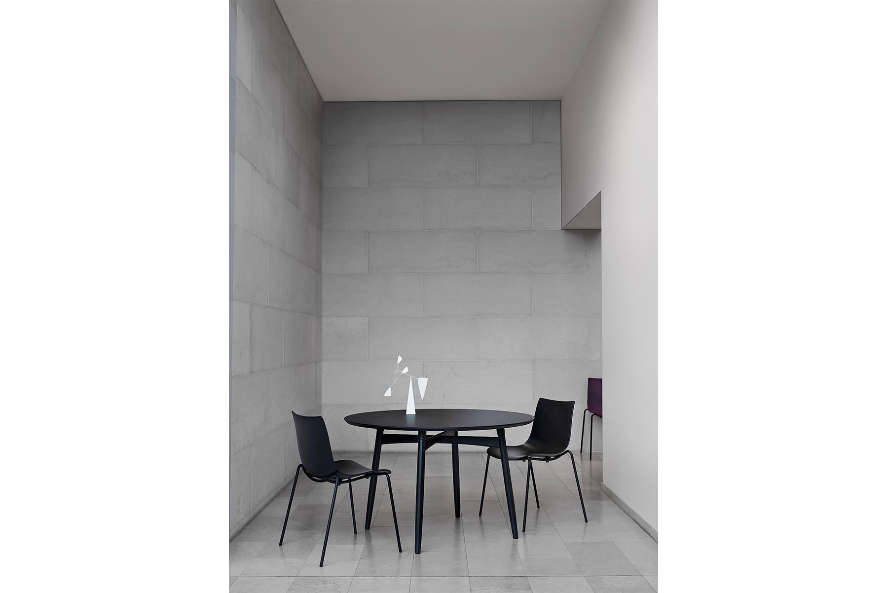 The BA103 Preludia round table by Brad Ascalon displays many considered details and a bold design that suits smaller spaces. The table is part of the Preludia Series that includes various size tables and chair options. The tabletop is available in