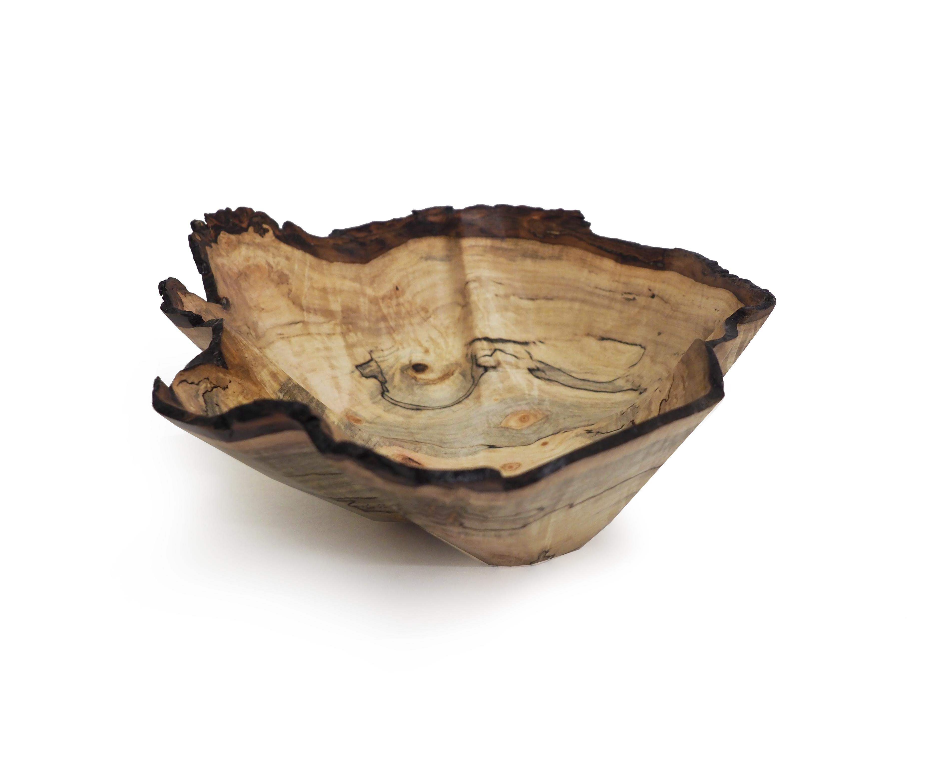Dogwood Blossom by Brad Sells is a beautiful sculpture crafted from maple burl. 