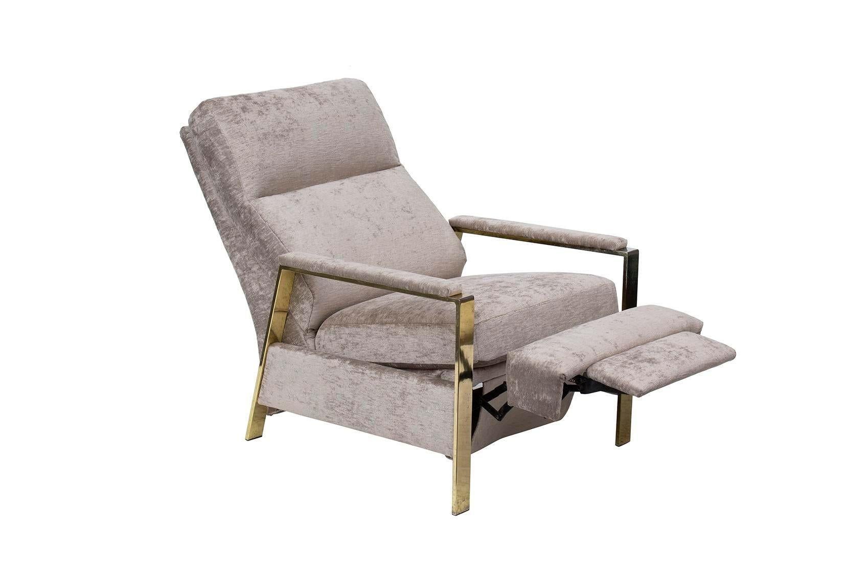 USA, 1980s
Milo Baughman-style reclining armchair with an angular goldtone frame. This chair has been newly reupholstered in a silvery grey slubby silk / cotton textured velvet. Label on underside says it is made by Bradington Young. This is a
