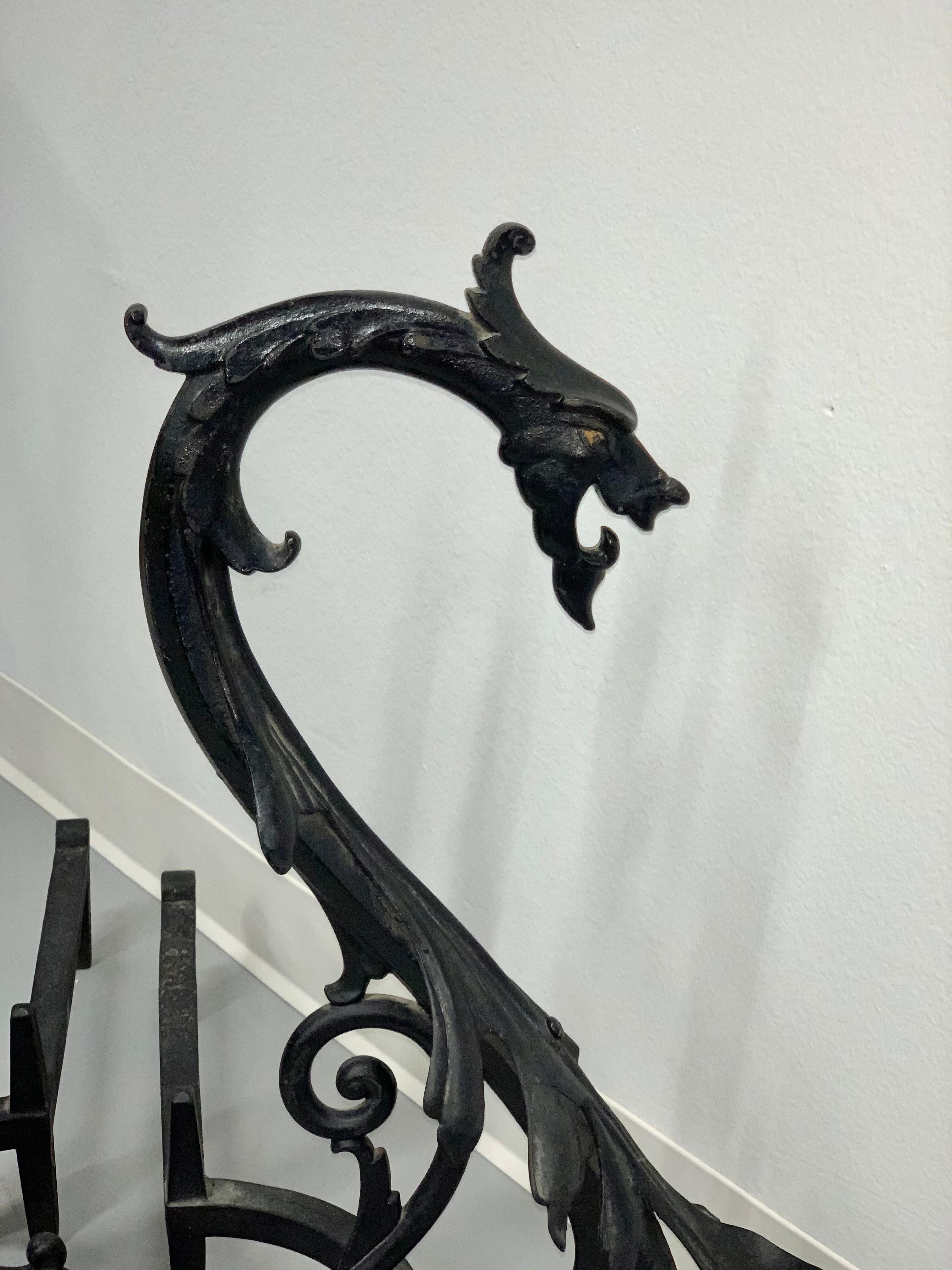A great pair of Arts & Crafts andirons by B & H Bradley and Hubbard. Stamped B & H on the inner part, this black paint is not original and probably 20-30 years old. The 