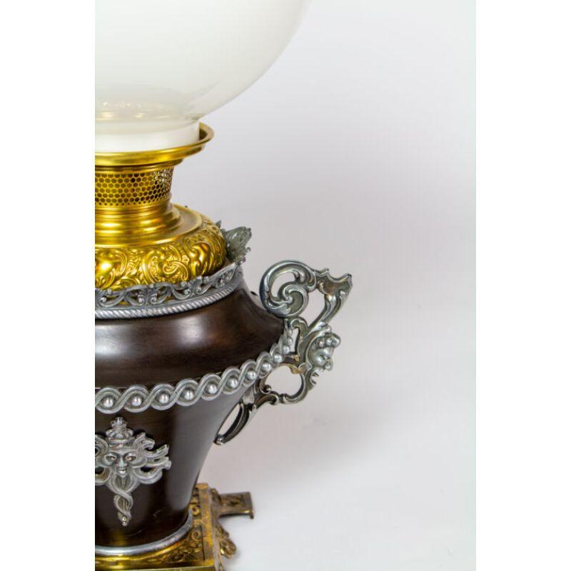 Bradley and Hubbard oil Lamp. Mixed metals, with a delightful bearded face. Electrified, white glass shade and chimney.  

Material: Bronze,Glass
Style: Victorian,Traditional
Place of Origin: United States
Period made: Late 19th Century
Maker: