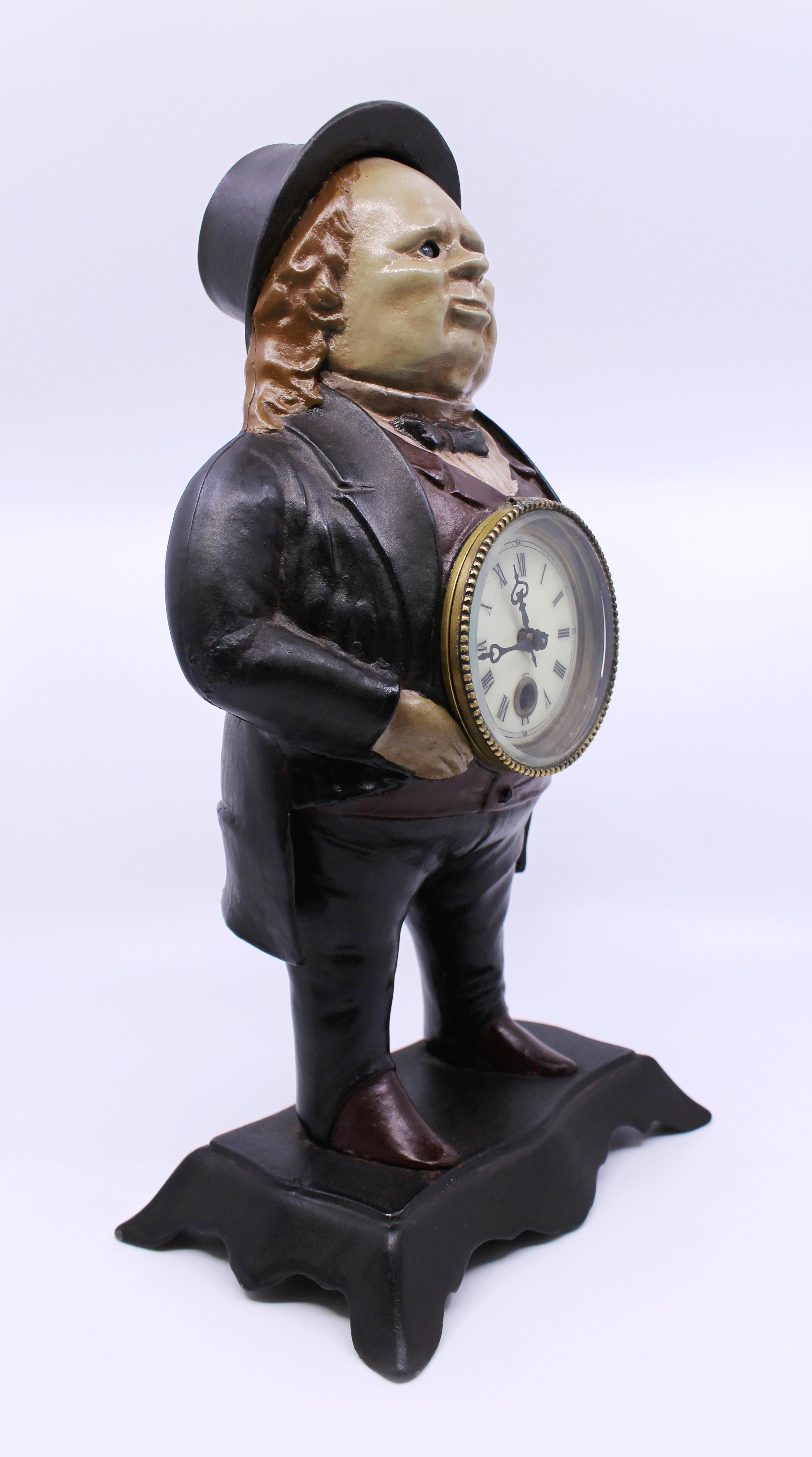 Period 
Antique, late 19th century,

Manufacturer 
Bradley & Hubbard, USA

Decoration 
Enamel dial with hand painted Roman numerals. Blued steel hands, single winding hole with brass outer ring. Cast iron body in the form of John Bull.