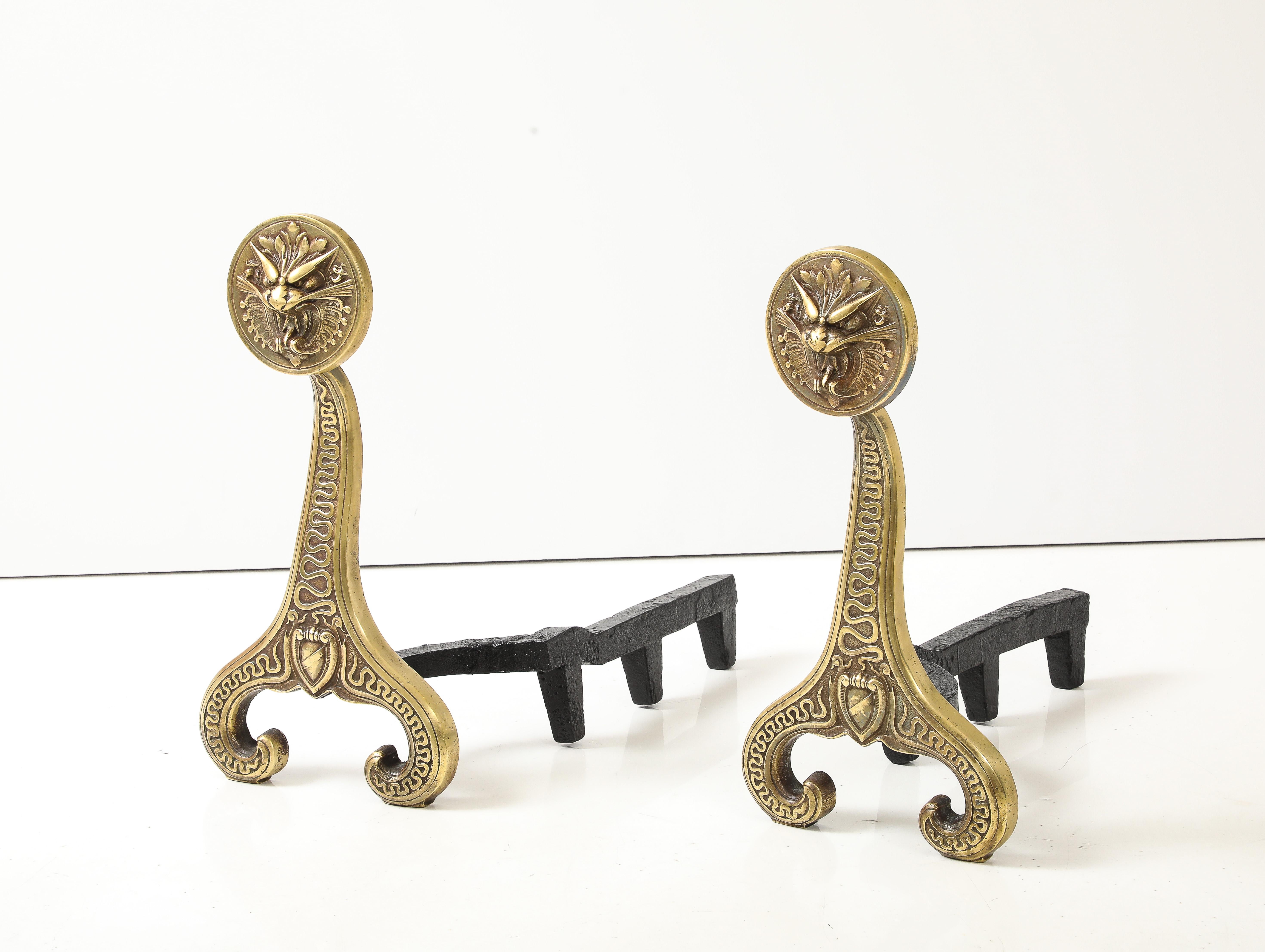 Amazing pair of 1886 solid brass and iron andirons by Bradley & Hubbard, in vintage condition with some wear and patina to the brass due to age and use, the brass was lightly hand polished.
