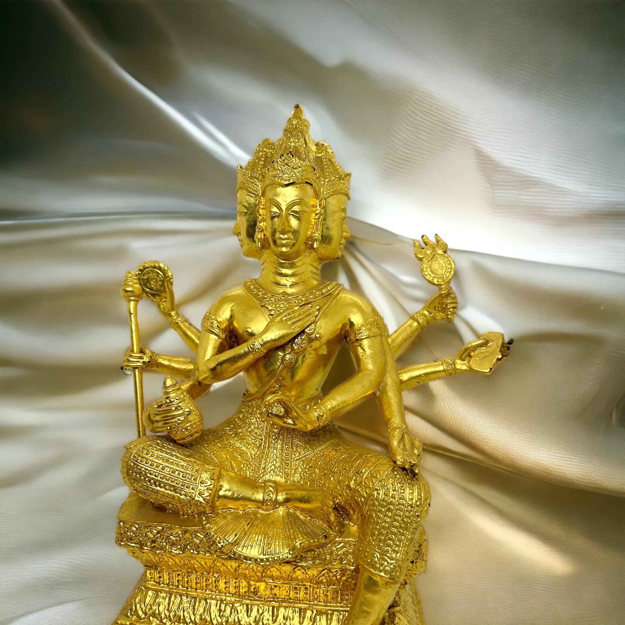 A decorative handmade sculpture or statue. Showing Brahma, the first of the three Hindu trinity, he is the creator of the universe. He is depicted with four faces looking at the four cardinal directions. Brahma is the first god in the Hindu
