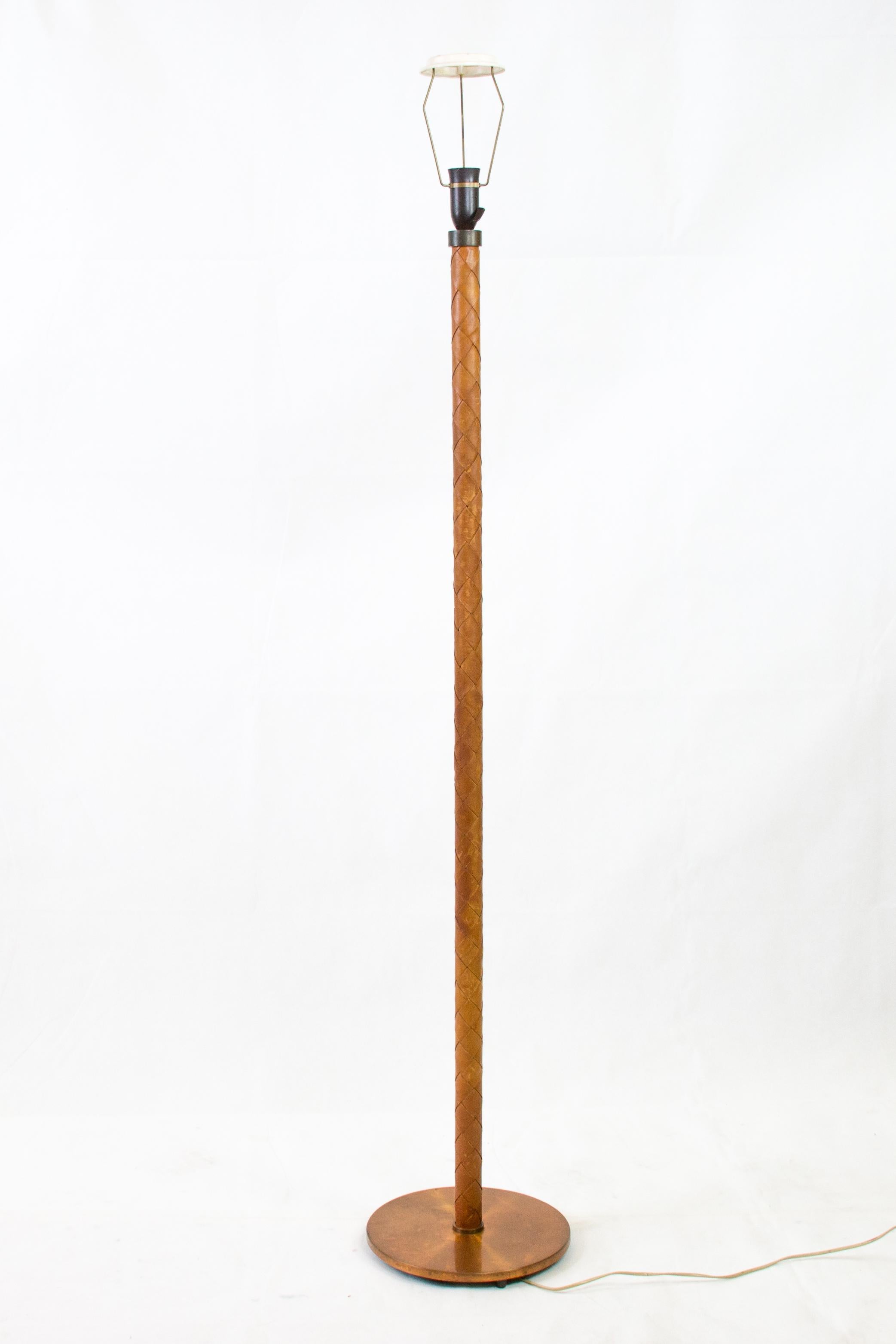 Rare floorlamp with braided leather shaft and copper foot
designed by Johannes Hammerborg for Fog & Morup