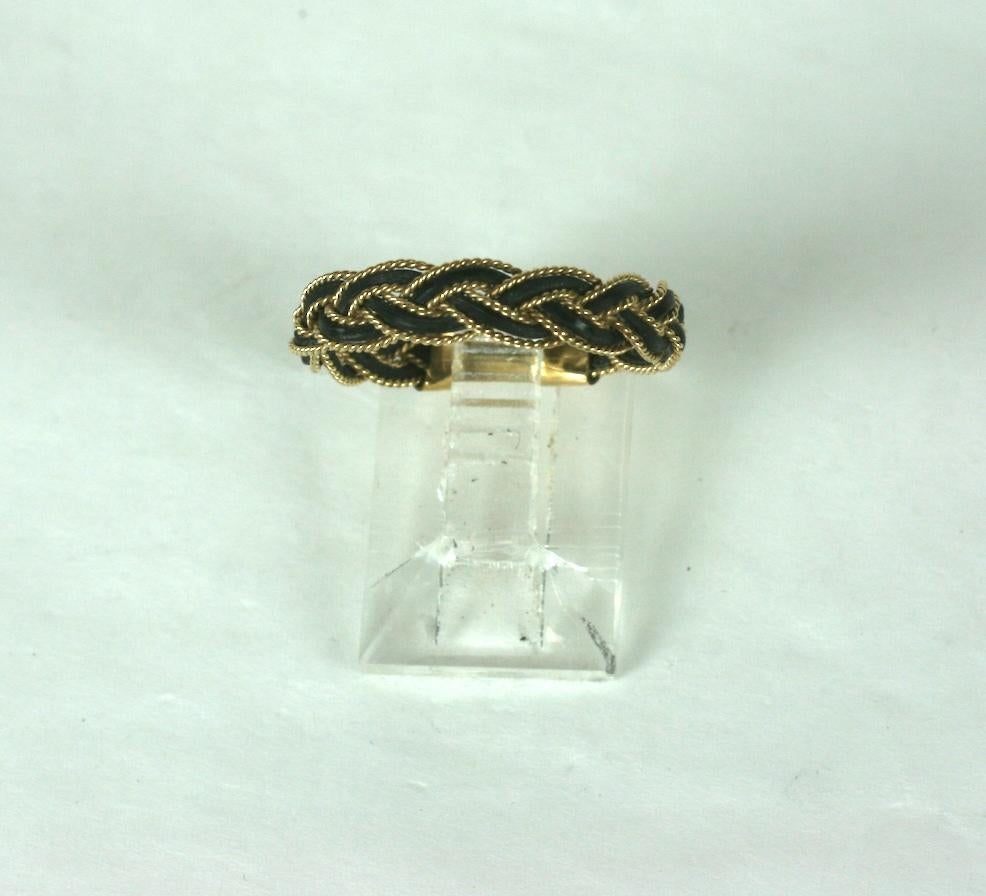 Braided 10k gold and Elephant Hair Ring from the 1970's. A staple of that period suitable for men or women. Size 8 US. Approx 1/8 wide.
DOMESTIC SHIPMENTS ONLY. 