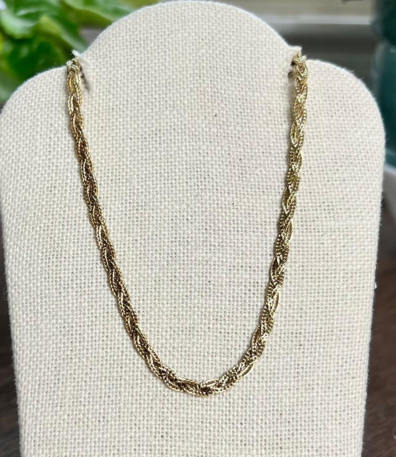 One 14 karat braided quadra-wheat link chain measuring 3.25mm wide, 18 inches long, and is complete with a square tube clasp.  