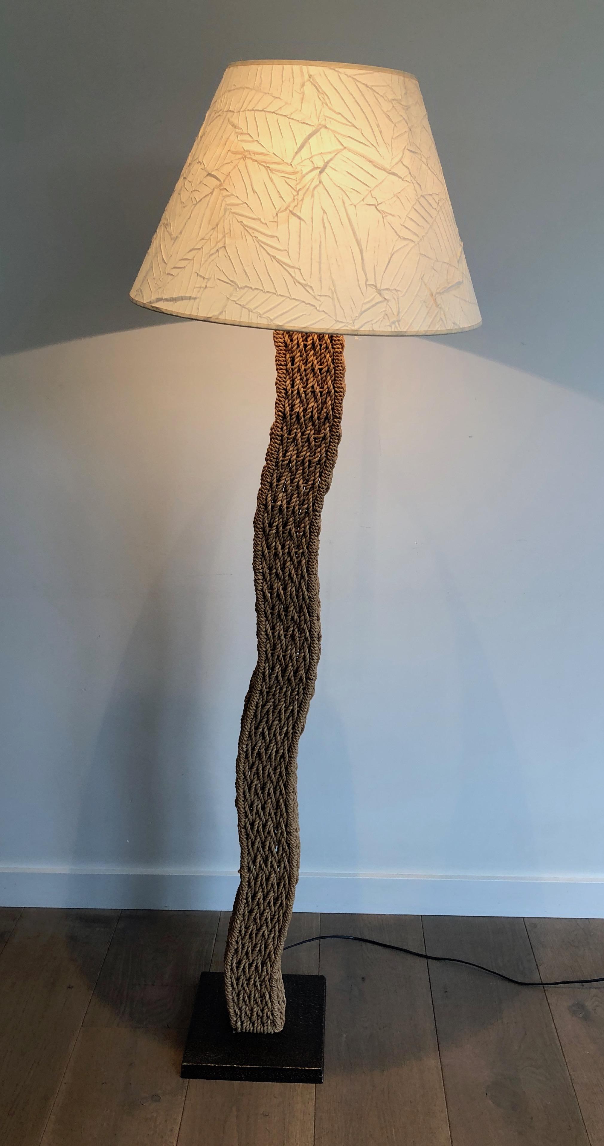 This very nice design floor lamp is made of rope on a square metal base. This is Japanese work by Tarogo, circa 1980.