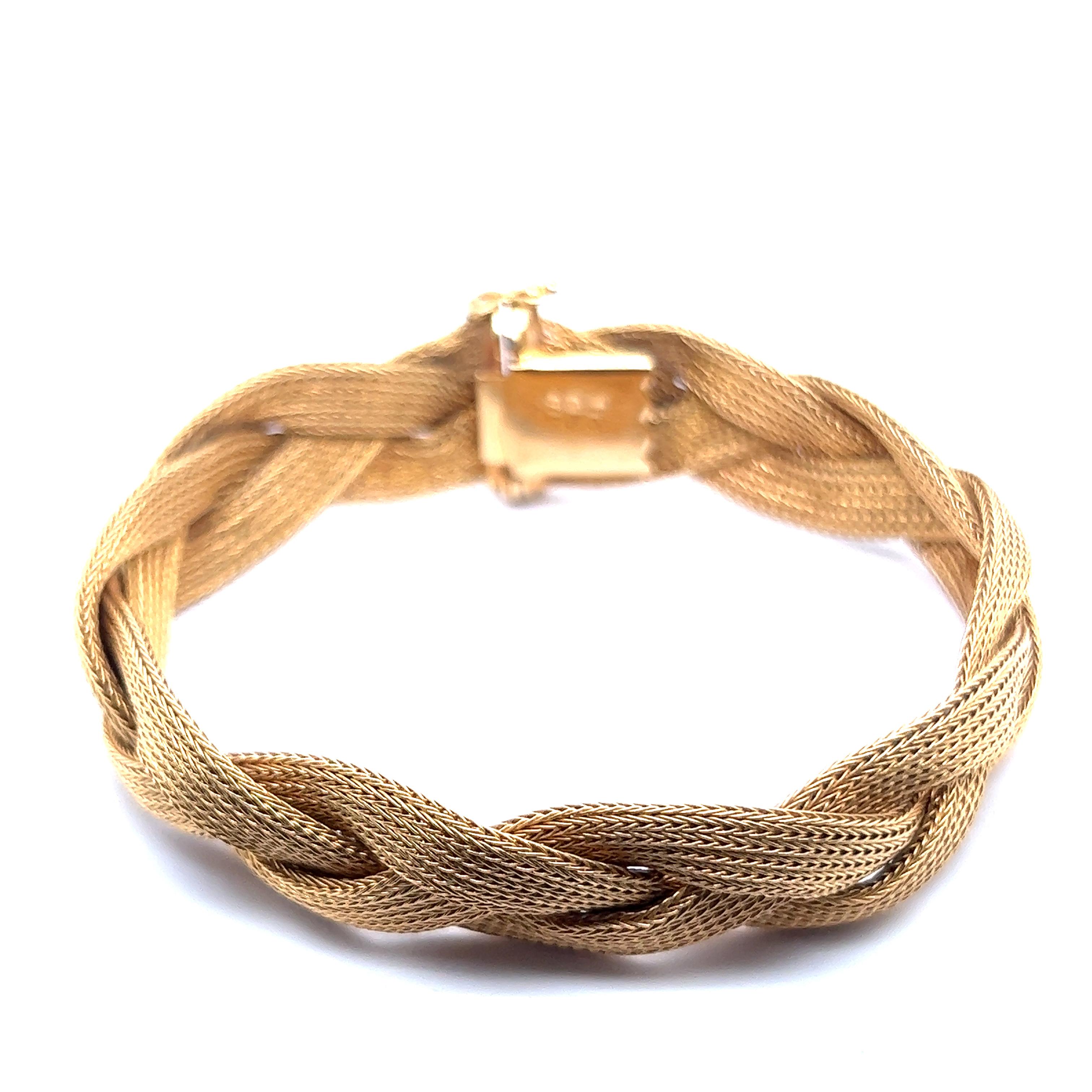 Introducing a classic piece - chic braided woven bracelet in 18 Karat red gold. Crafted with utmost care, this bracelet exudes charm and elegance. Delicately woven with three foxtail-style chains, it captures the essence of timeless style.

In a
