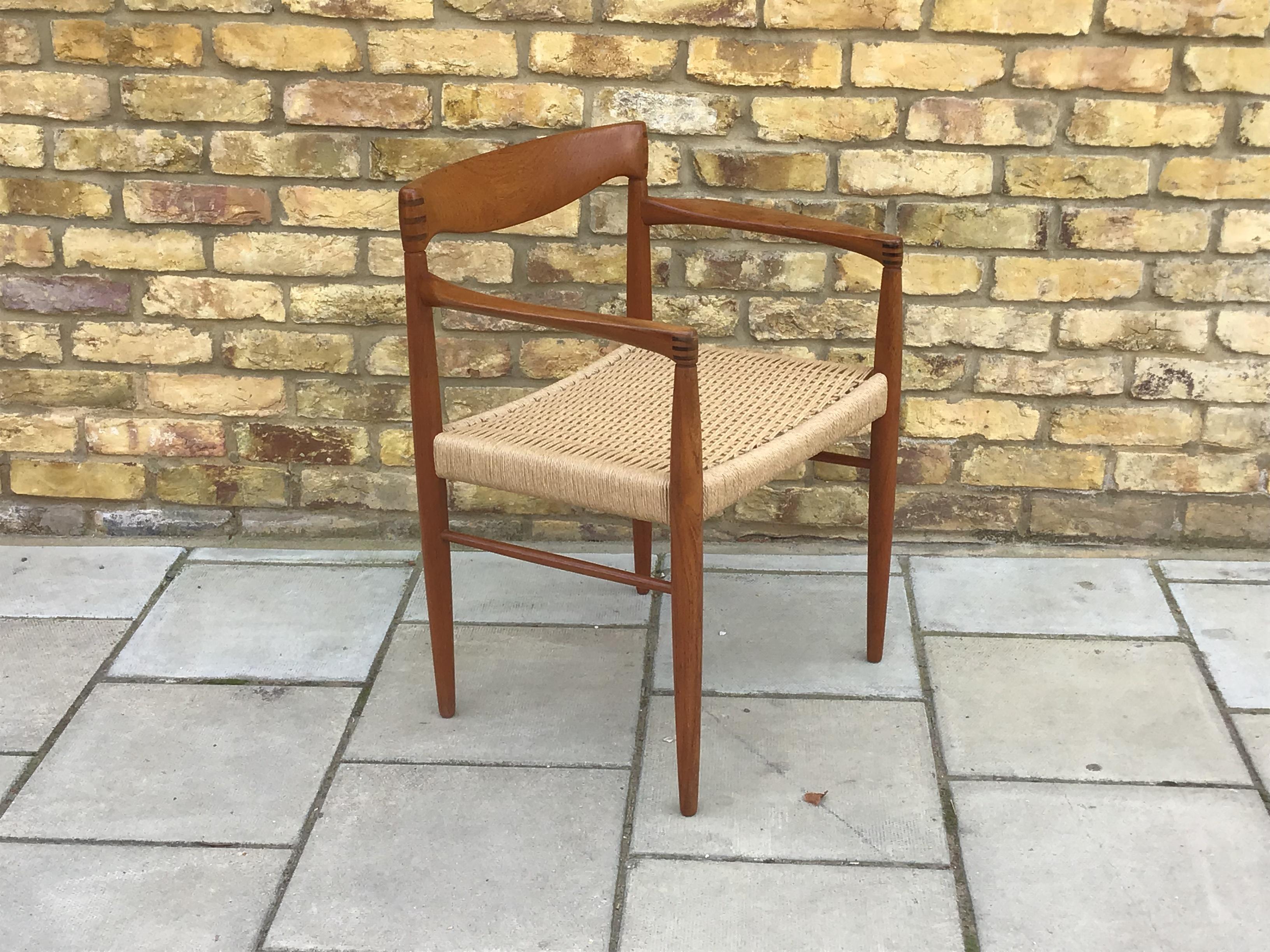 Beautifully simple designed craver chair with restored cord seating and exposed joints in teak, circa 1960s by H.W. Klein for Bramin.