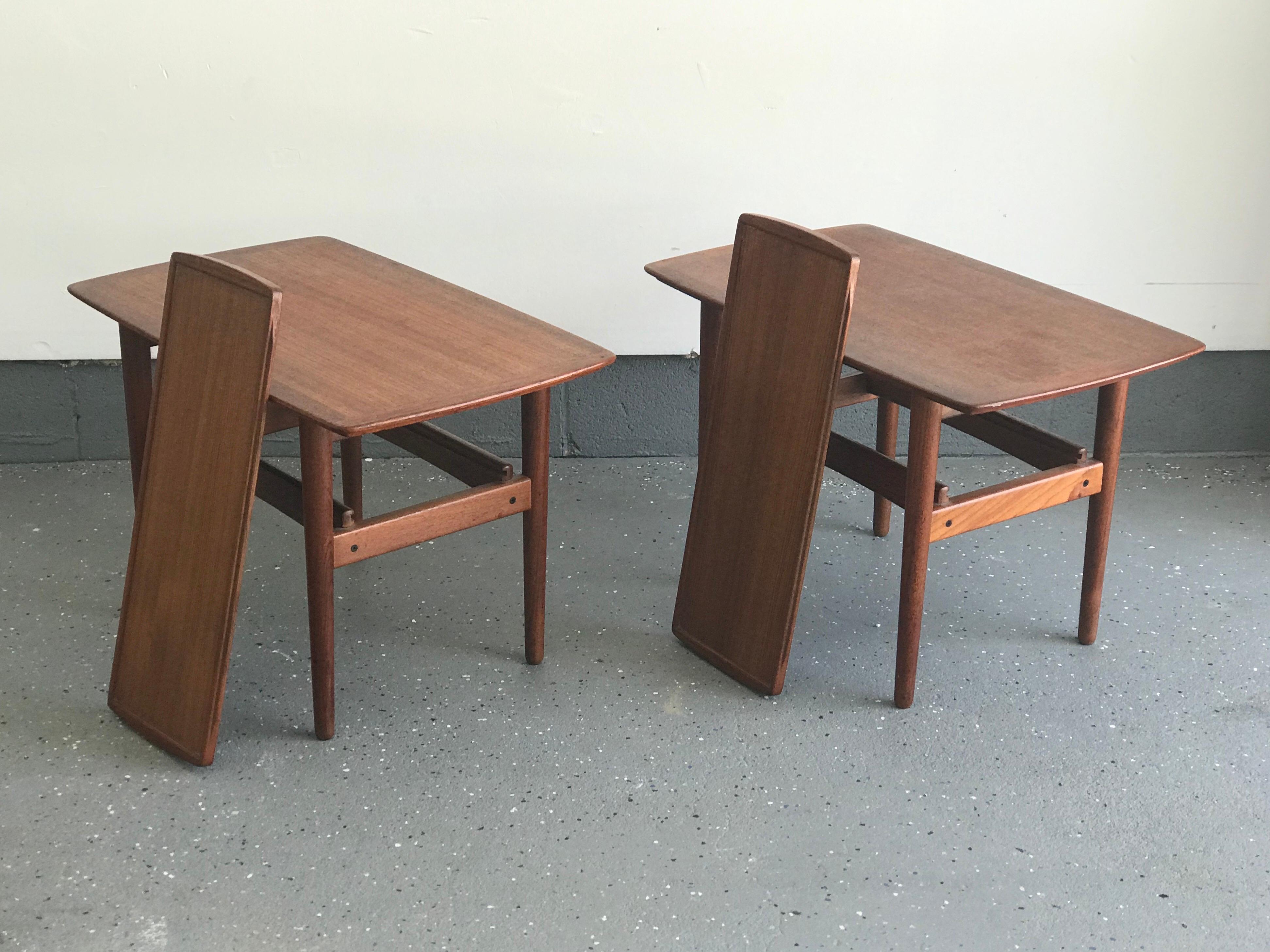 Beautiful teal end tables or nightstands by Bramin. Features tapered legs, and a sliding/ removable tray shelf. Very good vintage condition, with some tear to top. Please see pictures for reference.