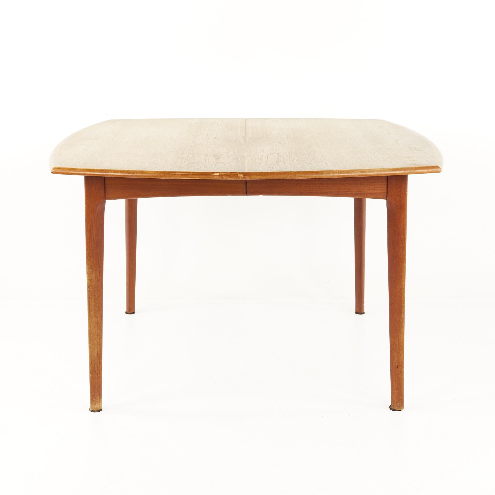 Bramin mid century Danish teak hidden leaf dining table

The table measures: 47.25 wide x 47.25 deep x 27.75 high, with a chair clearance of 24.75 inches; each leaf is 29.5 inches wide, making a maximum table width of 106.25 inches when both