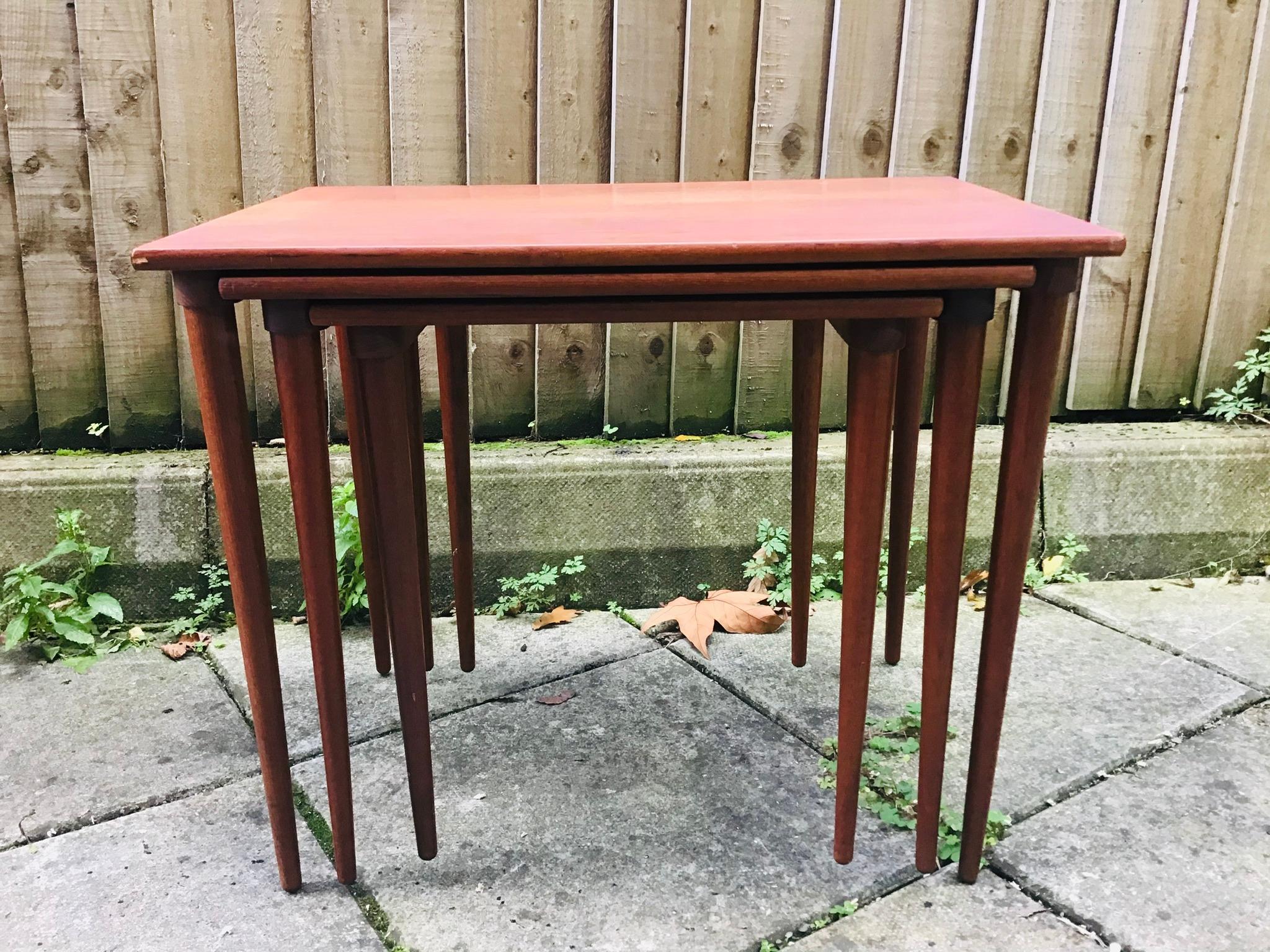 Stunning set of Danish made nesting tables. The smaller tables actually nest into the bottom overlapping grove of its larger table, 
Cc HW Kllein.