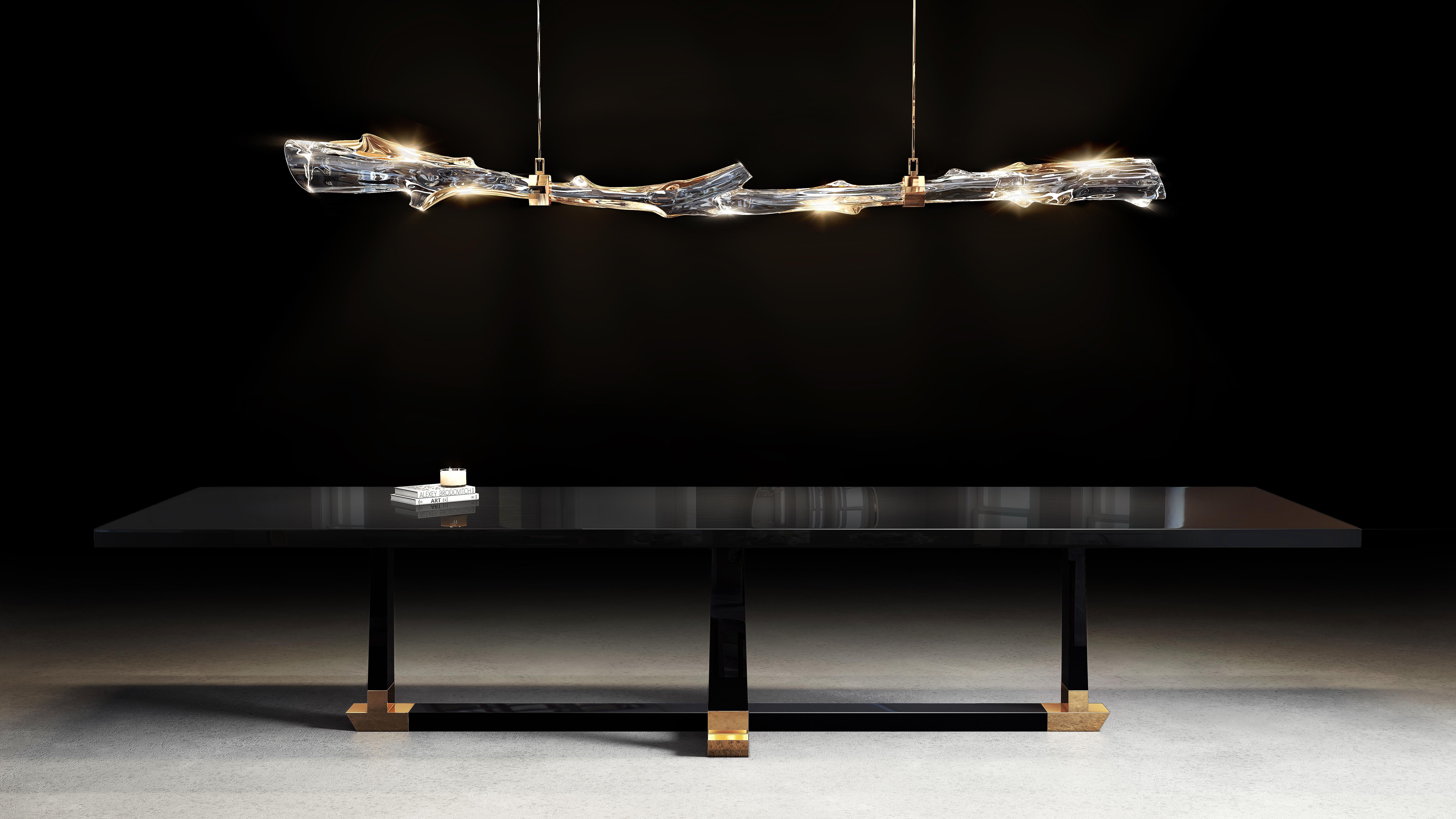 Introducing you to our first 2023 design, the Branch D’or Chandelier. A namesake, organic piece instigated by Barlas Baylar. The Branch D’or embraces a sturdy plexi acrylic glass branch with alternating tinges of bronze, complete with custom bronze