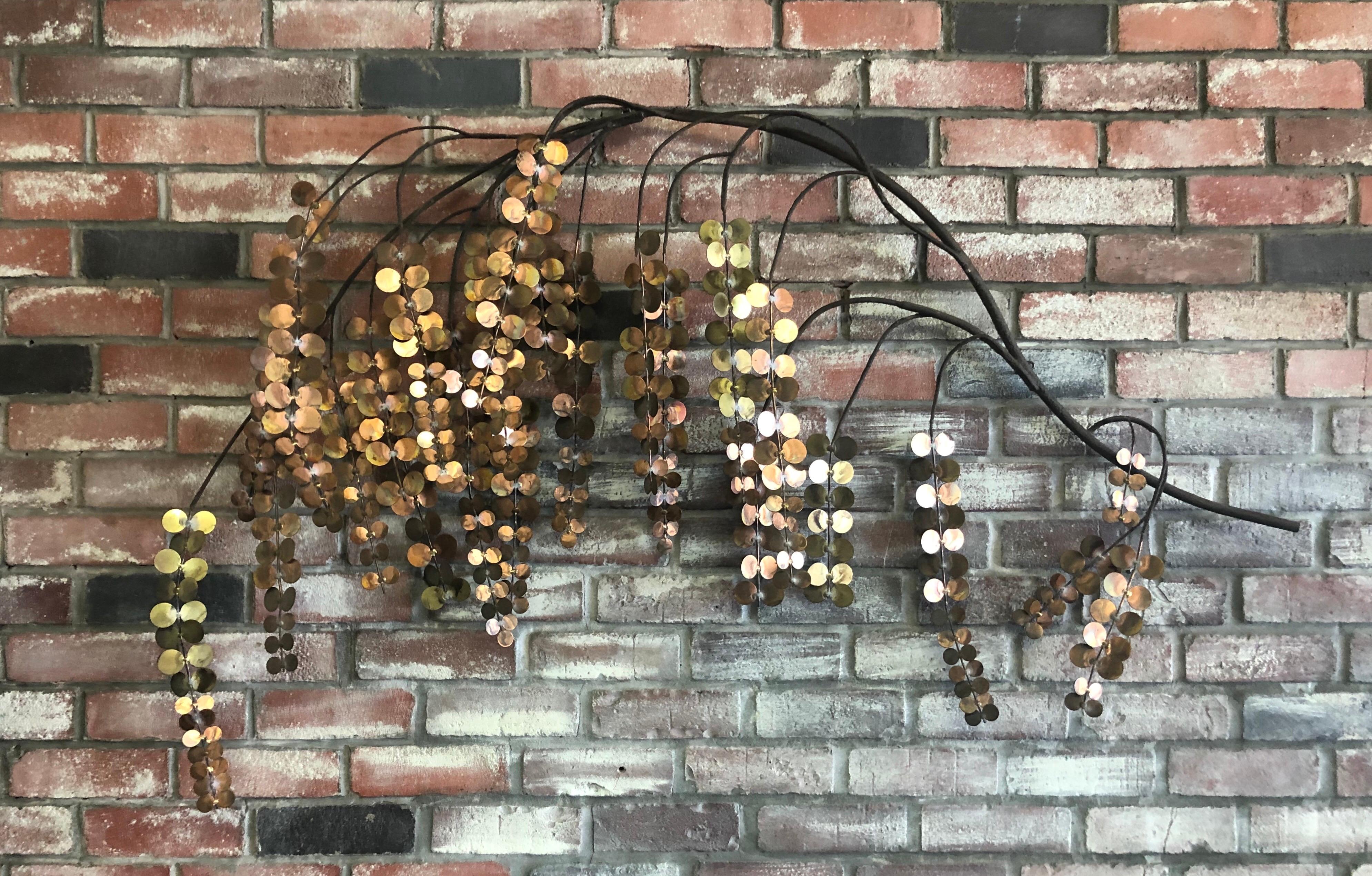Unique and quite rare mixed metal wall sculpture by C. Jere for Artisan House, circa 1970s. The piece, depicting a tree branch with hanging leaves, is in very good condition and has great color and craftsmanship. The sculpture displays patina