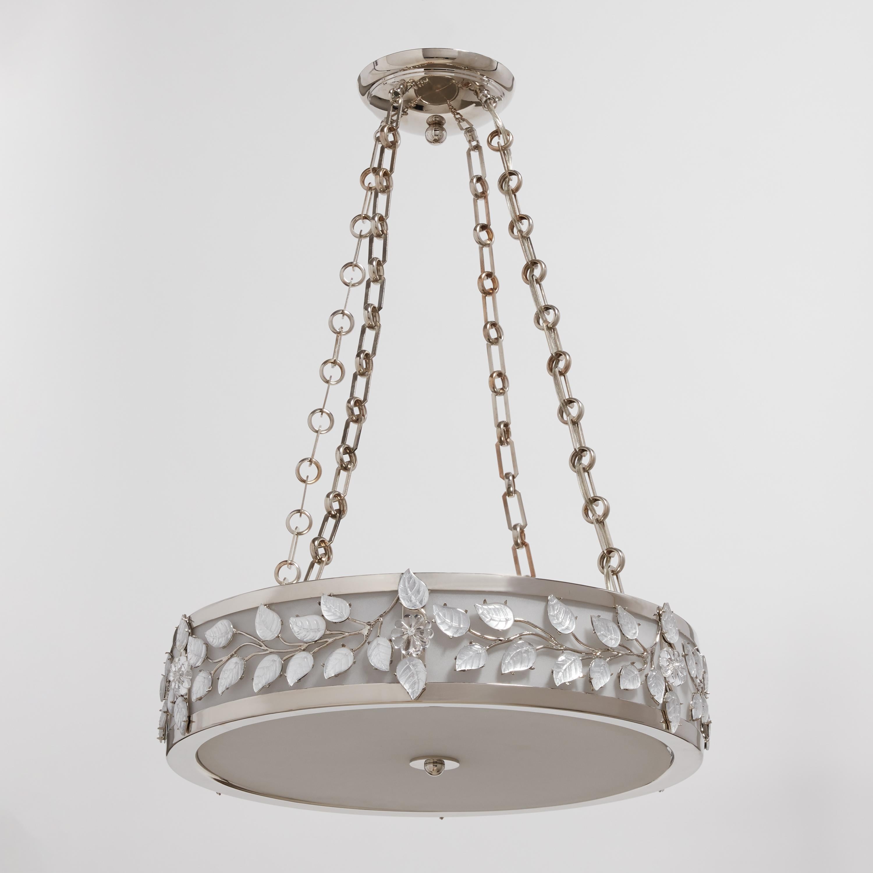 An Art Deco style pendant fixture designed by David Duncan. Featuring an exquisite nickel finish, this light is encircled by cast bronze branches with crystal leaves, and is suspended by four chains. This fixture is 20