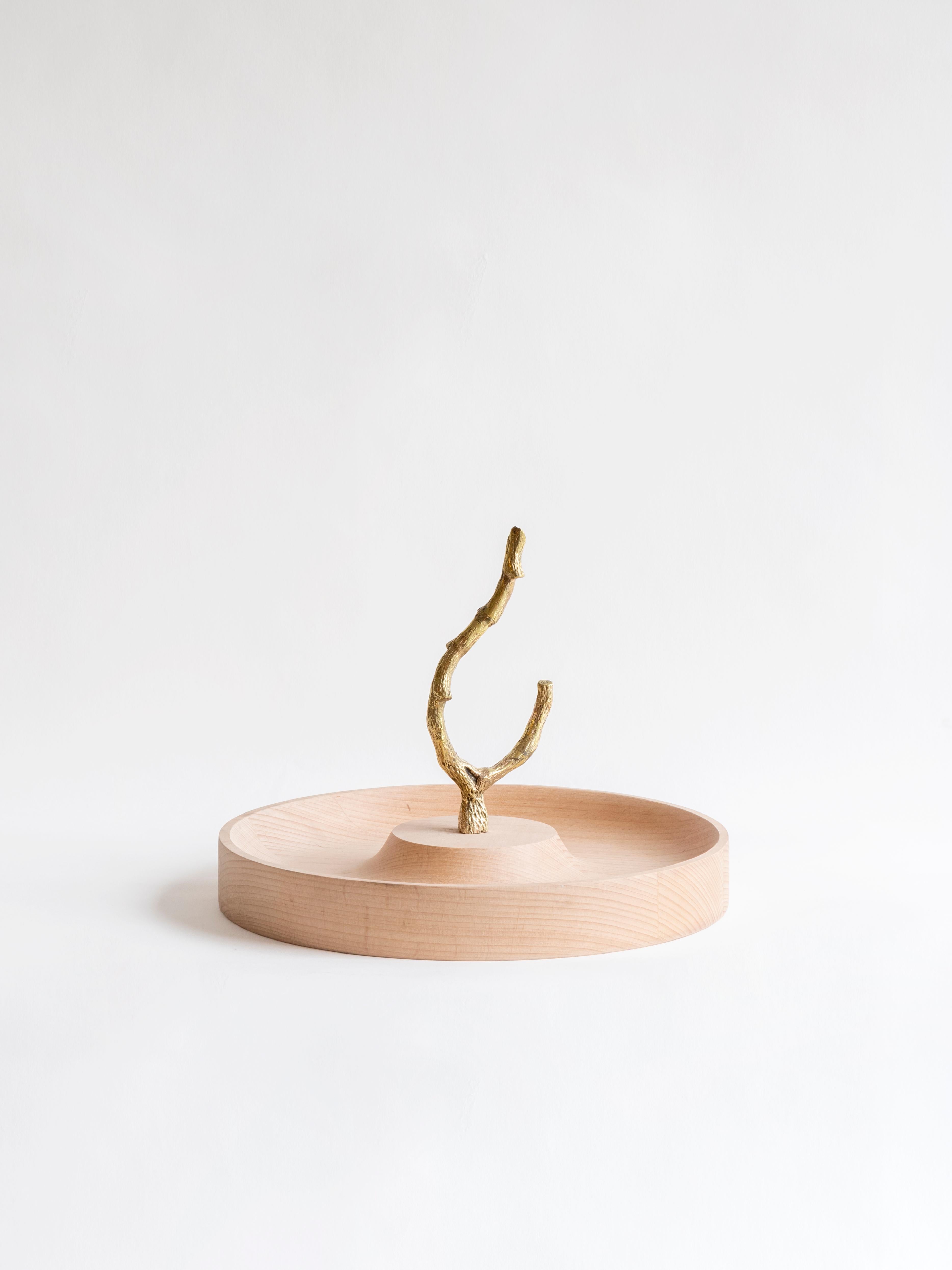 Branch T-Trays by ZPS Studio
Dimensions: D 2.5 x H 1.8 cm
Materials: Wood, brass.

Hand lathe turned centerpieces in beech wood, with an elegant natural finish that contrasts beautifully with the central cast bronze handle, skillfully crafted by a