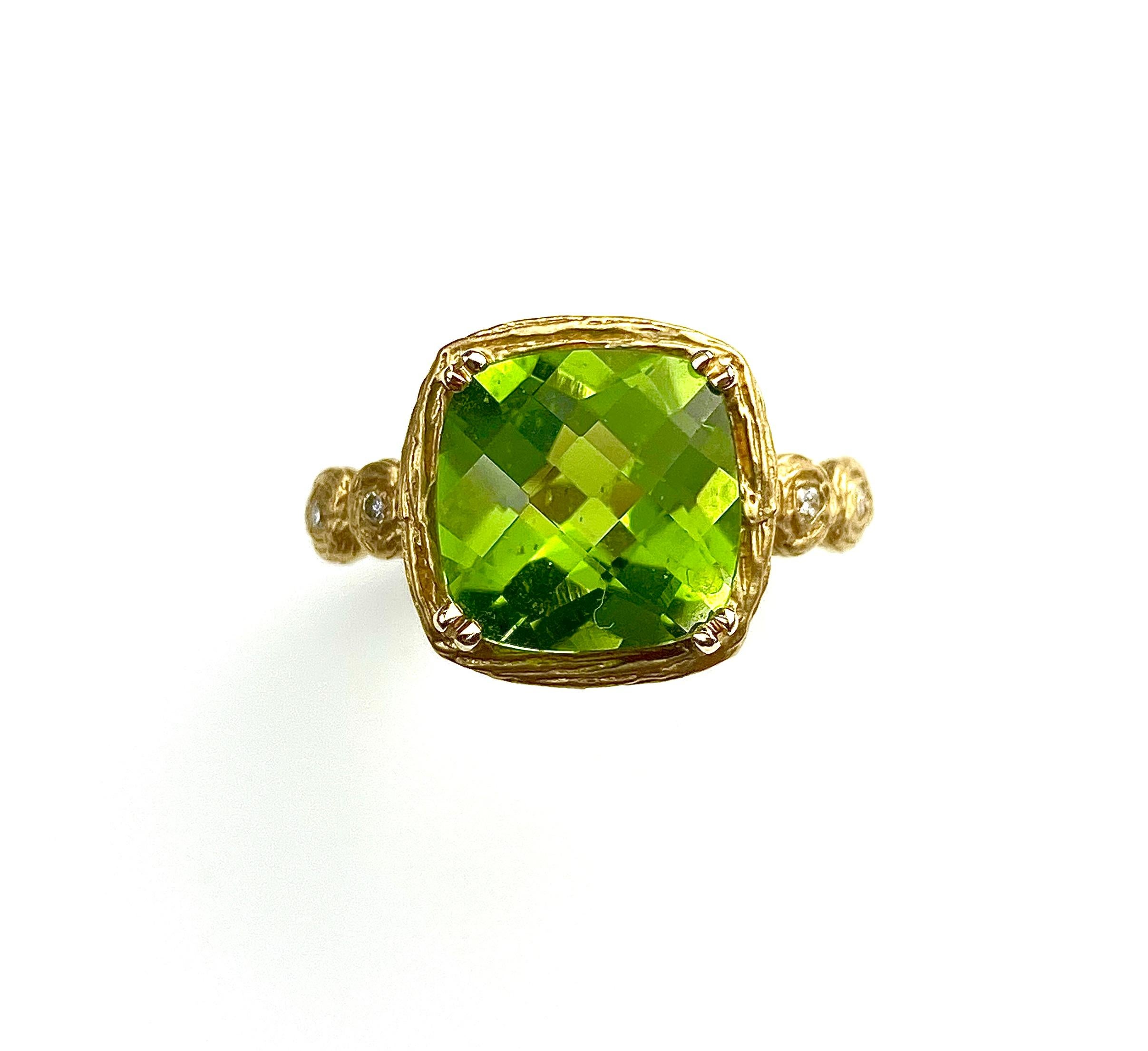 Branch textured cocktail ring with a 10mm square checkerboard cut Peridot, 4.79ct. Set with 4 small diamonds on the side totaling 0.05ct in 14kt yellow gold. Ring size 7. Ring resizing up or down two sizes included in pricing.