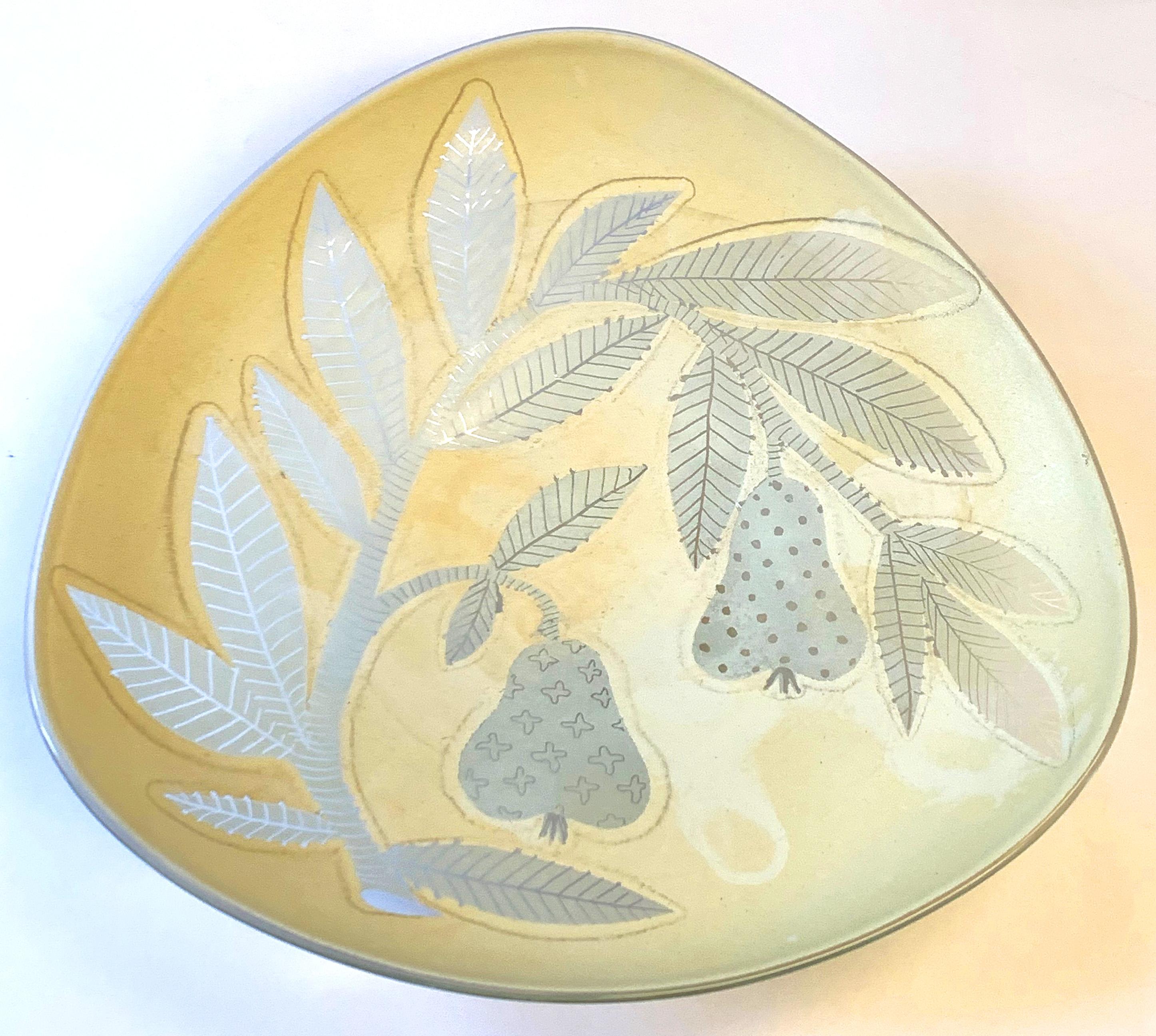 Layered with enamel and etched by the artist, this remarkable bowl depicting tree branches laden with pears was created by Waylande Gregory, probably in the 1940s. Prodigious and indefatigable, Gregory produced a wide range of sculptures and wares