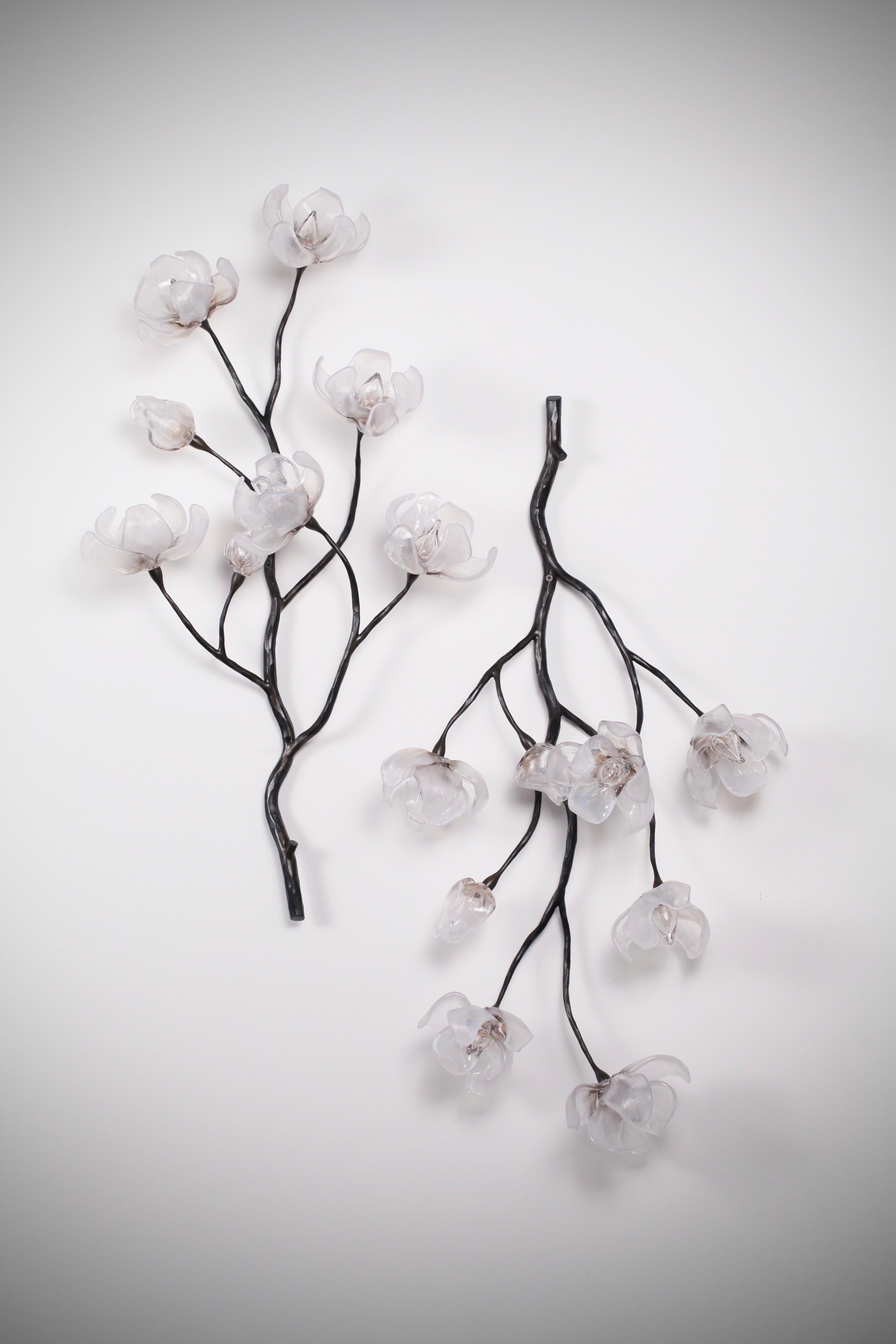 Branching Magnolia Wall Sculpture, designed and created by Elizabeth Lyons. Each one-of-a-kind piece is handmade and can be ordered as one piece or in multiples. with three glass color options available.

Hand-blown and sculpted glass magnolia