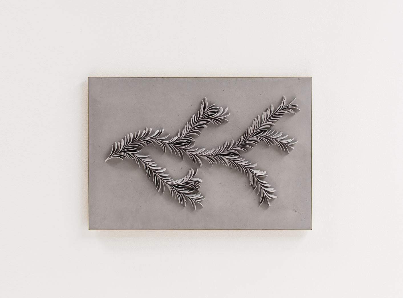 This Branching Porcelain artwork was handmade by Olivia Walker in her studio in Dartmoor National Park in England. All of the porcelain shards are individually made by hand, and applied to a natrual lime plaster surface, creating a branching flow of