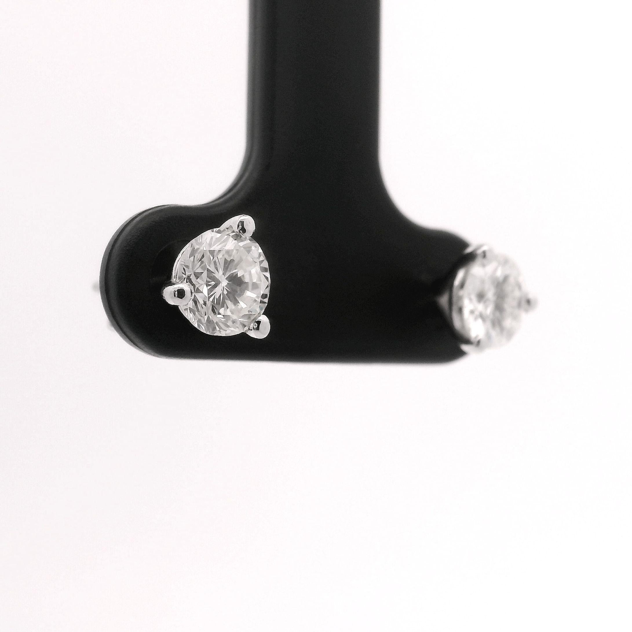 Condition:  Brand New
Metal:   14k White Gold
Diamonds:  Pair of Round Cut Natural Diamonds 1.2cttw
Diamond Color:  G
Diamond Clarity:  SI3-I1
Diamond Width:  5.3mm
Setting:  Martini
Backings:  Butterfly Push Backs
Markings:  