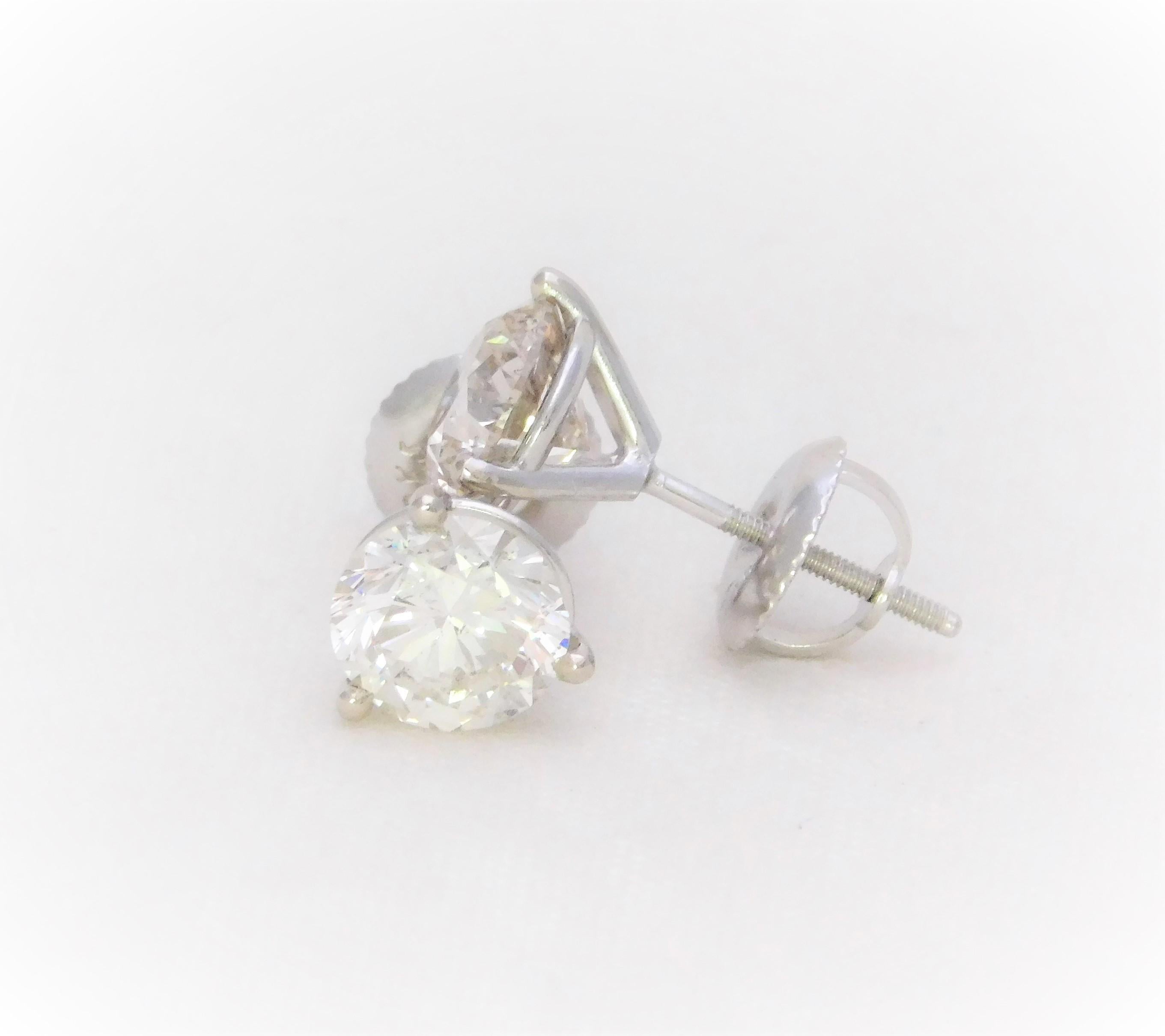 Next to a diamond engagement ring, the set of diamond stud earrings represents the most important staple in an elegant ladies’ wardrobe. 
Custom-made, brand new, and never worn.  This set of lovely diamond stud earrings have been crafted in solid